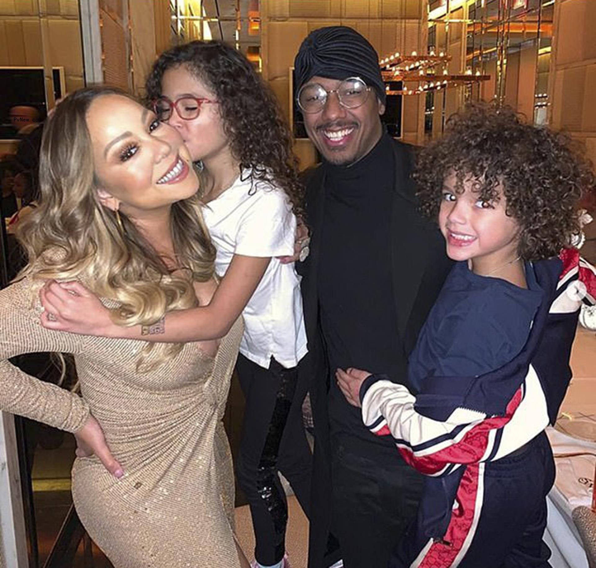 Mariah Carey and Nick Cannon hold Moroccan and Monroe
