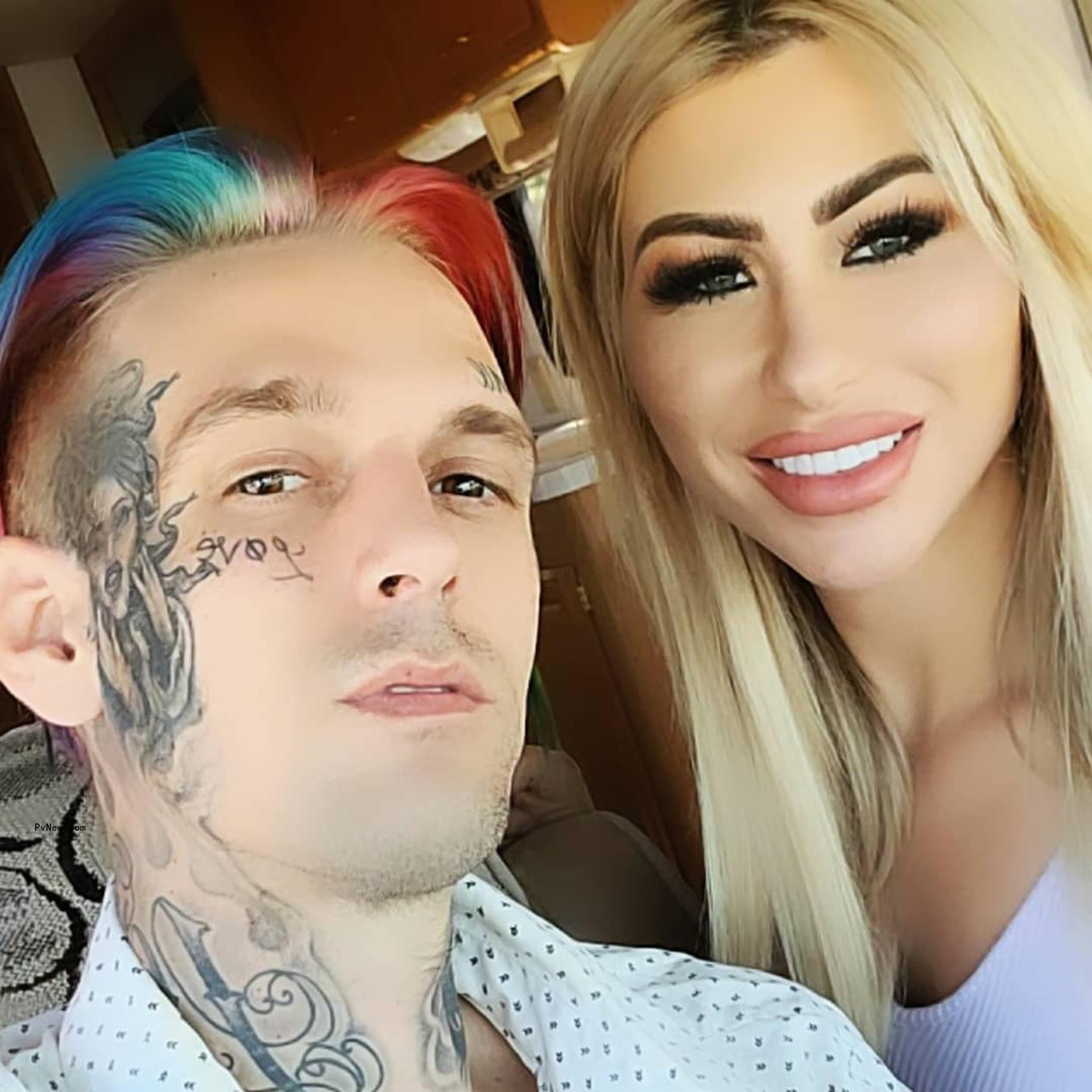 Aaron Carter and Melanie Martin posing for a selfie.