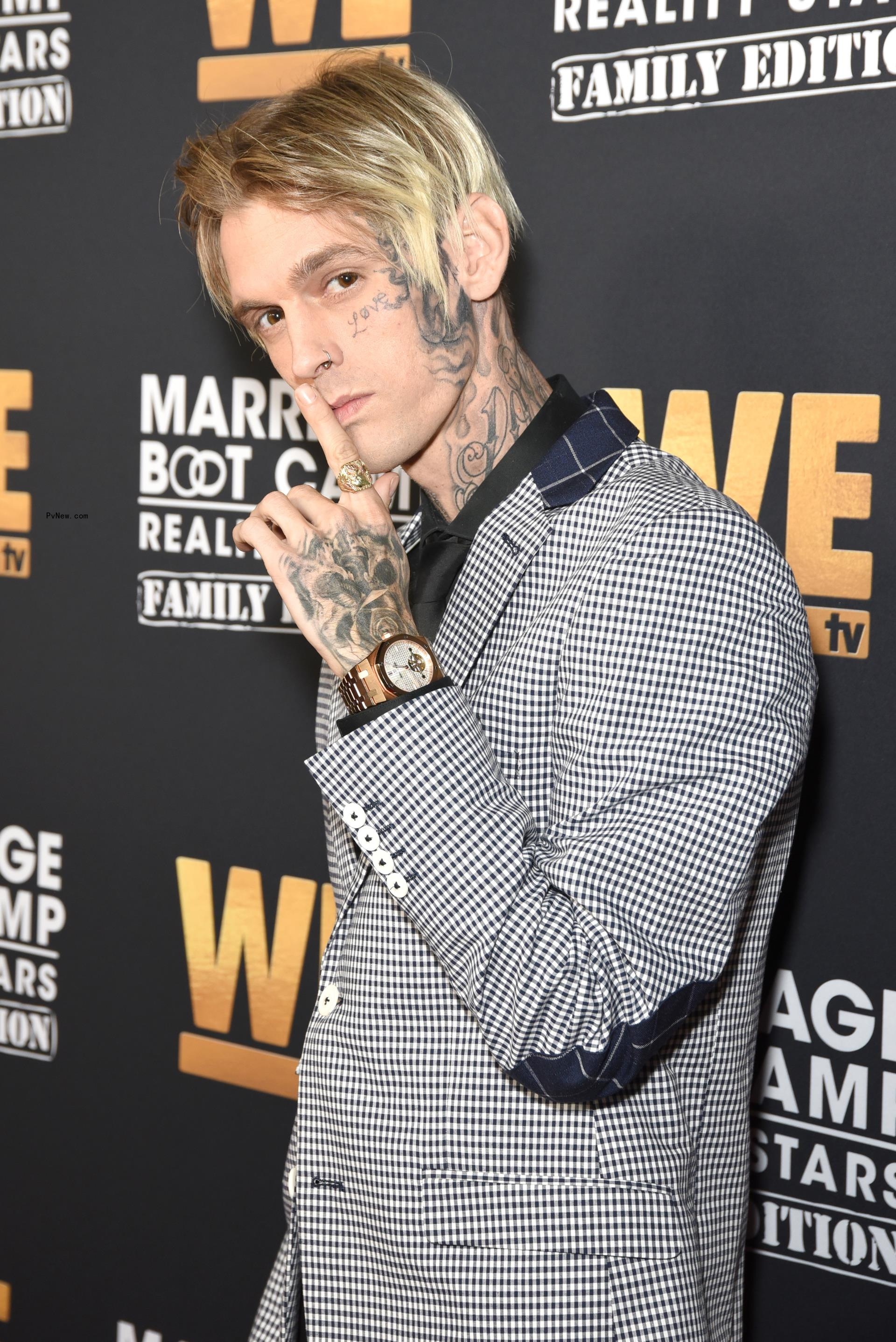 Aaron Carter posing on a red carpet.
