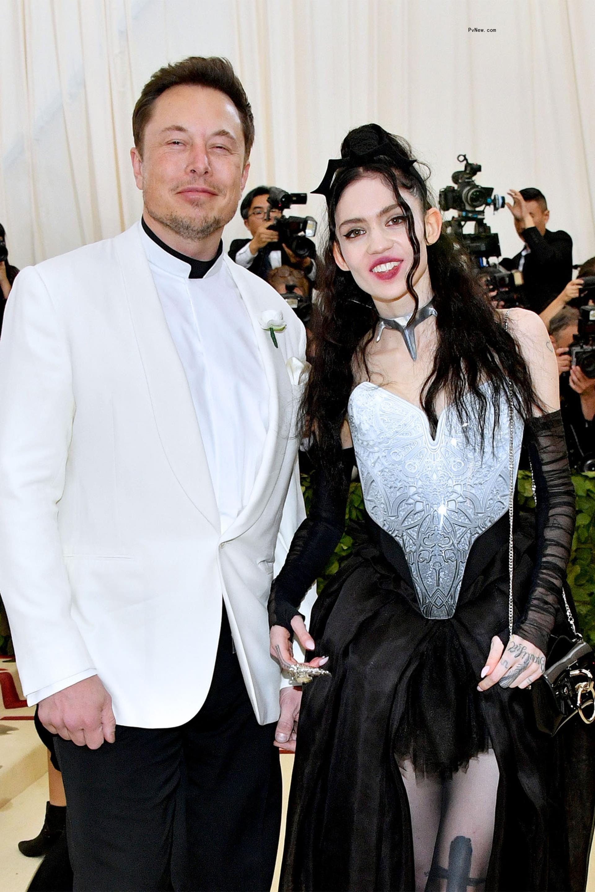 Suited Elon Musk and Grimes on Met Gala red carpet