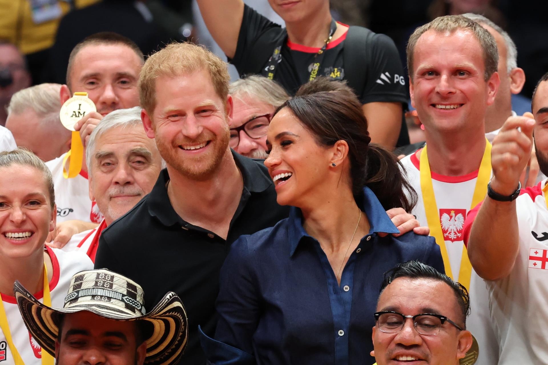 Prince Harry and Meghan Markle sitting together 