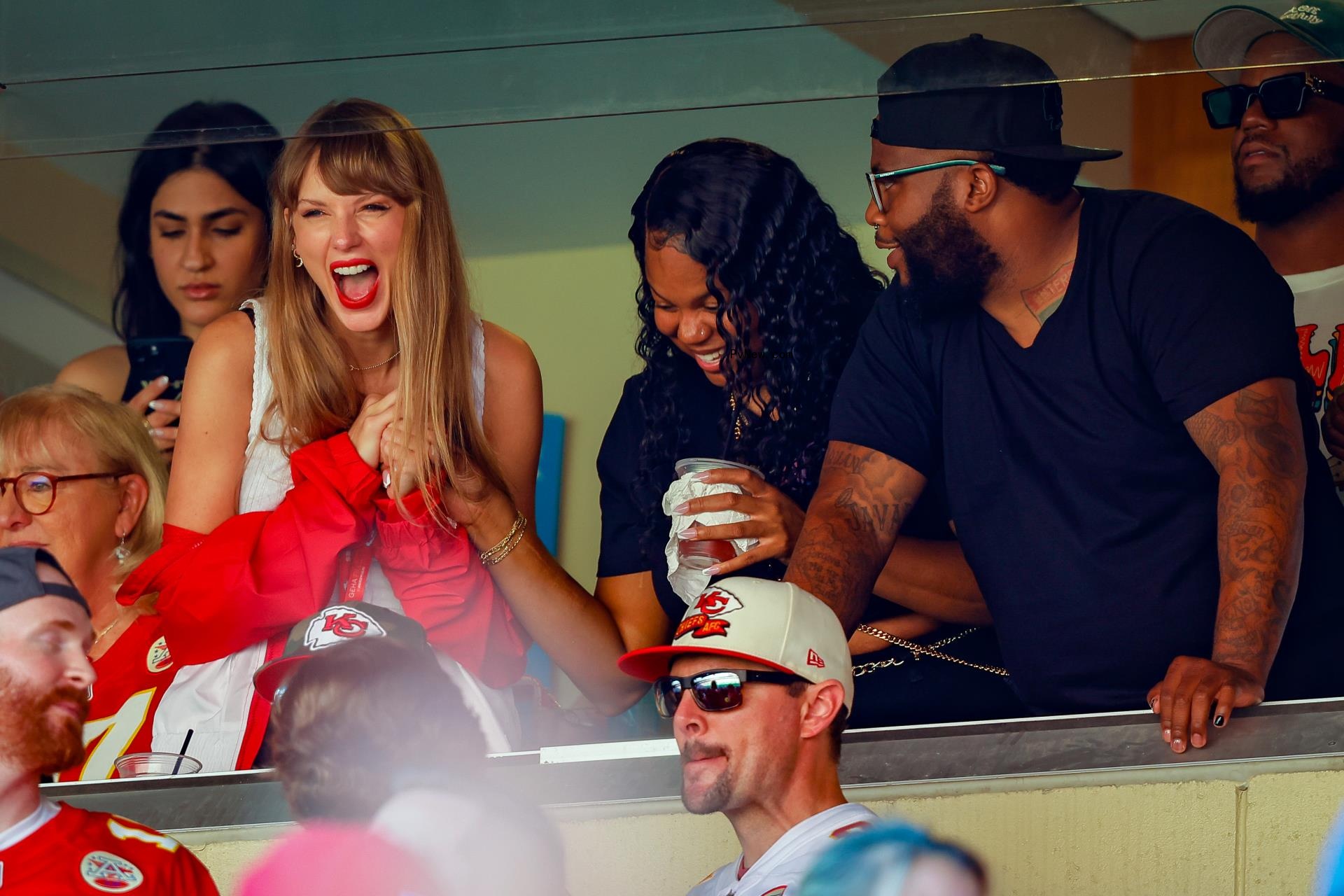Taylor Swift cheering for Travis Kelce.