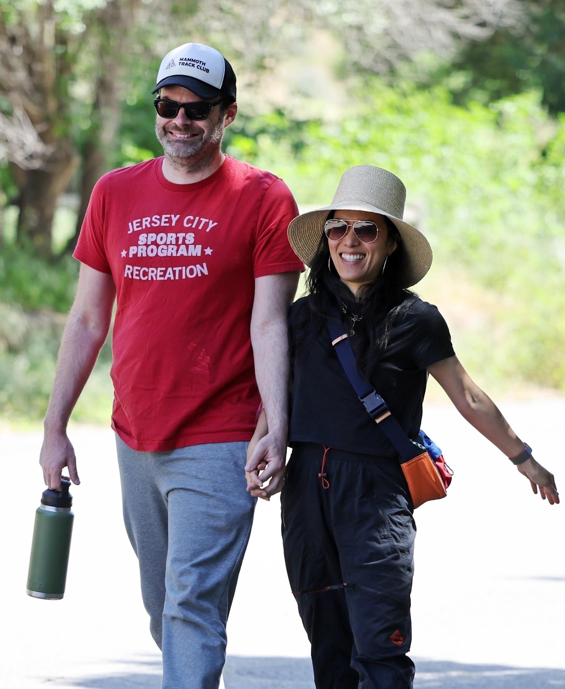 Bill Hader and Ali Wong hold hands