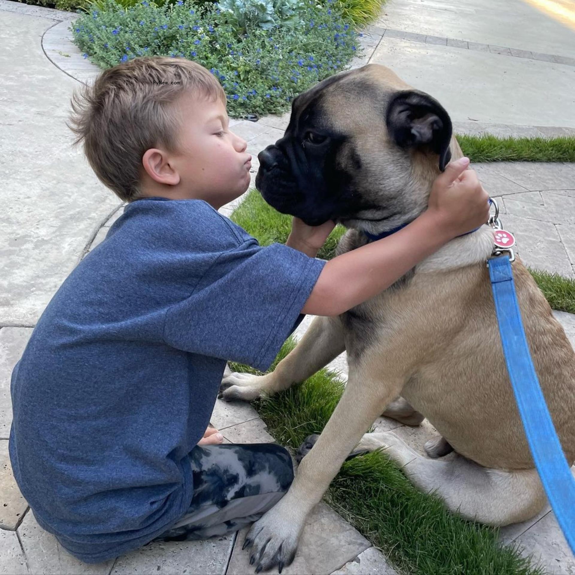 Sean Lowe's son Samuel cuddles dog Gus