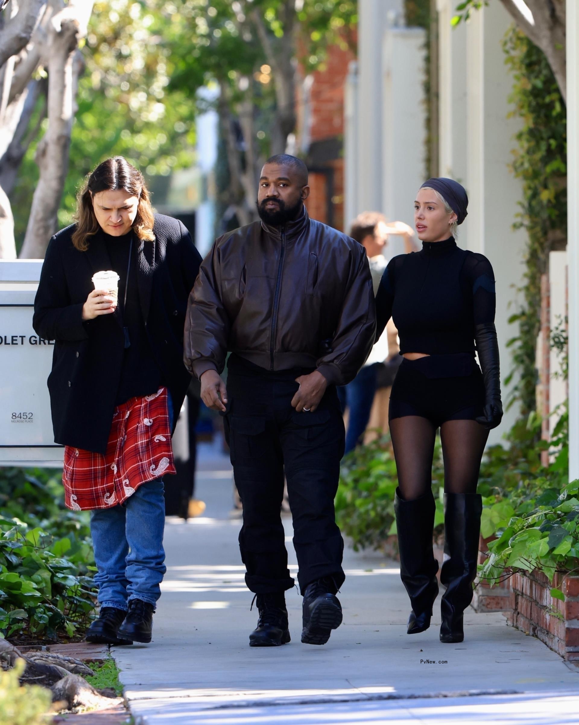 Kanye West and his wife Bianca Censori walking together