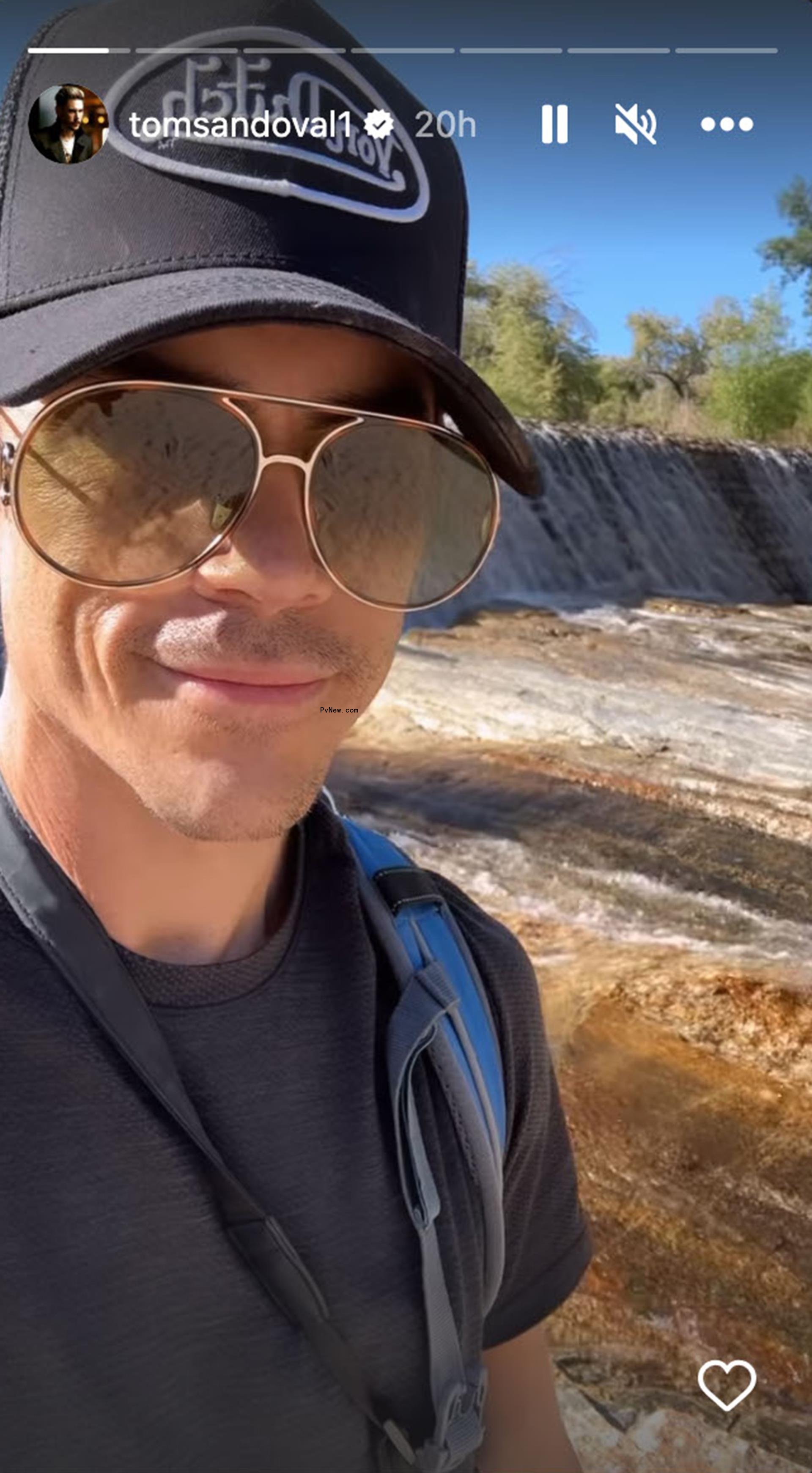 A selfie of Tom Sandoval by a waterfall