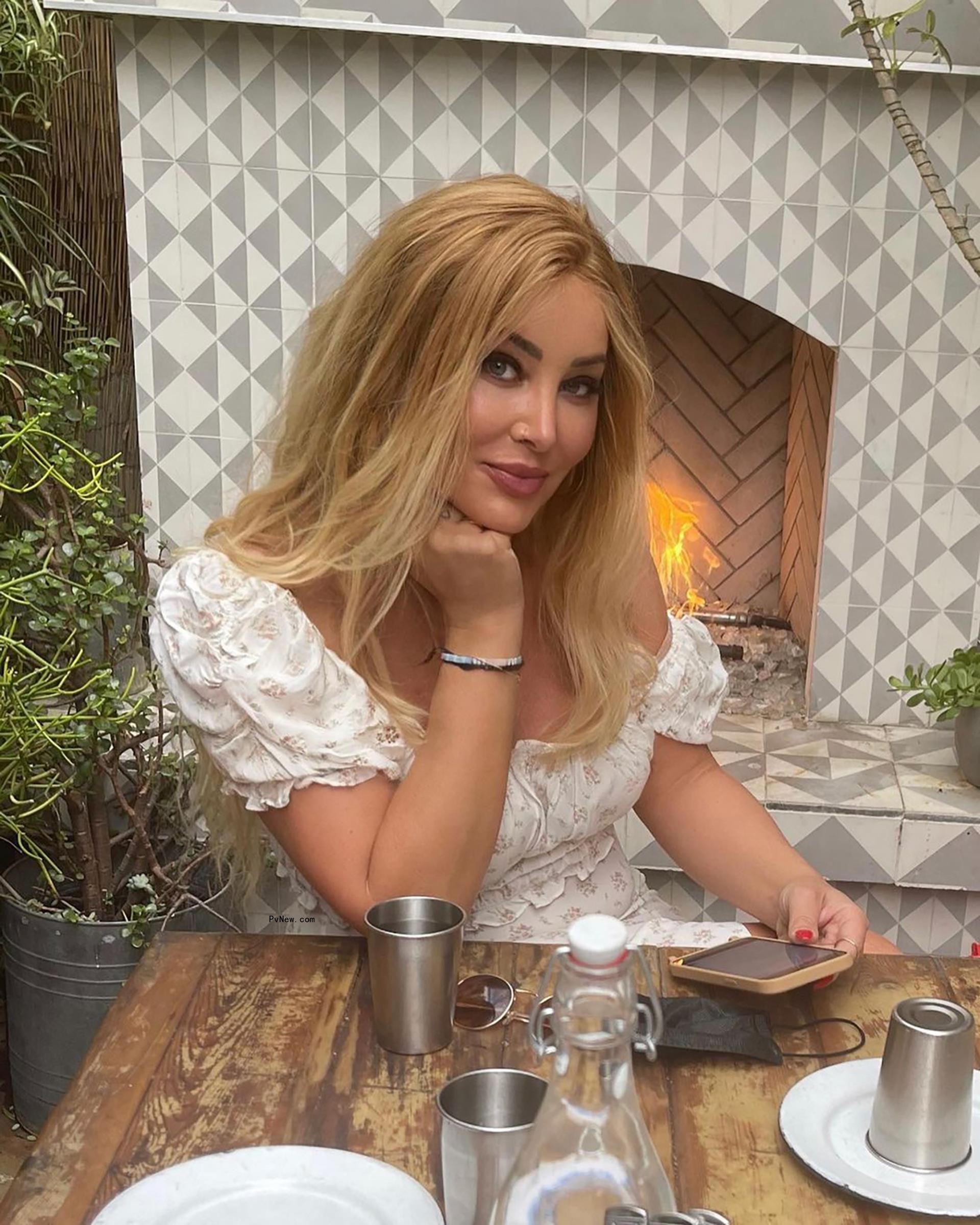 Billie Lee poses in white