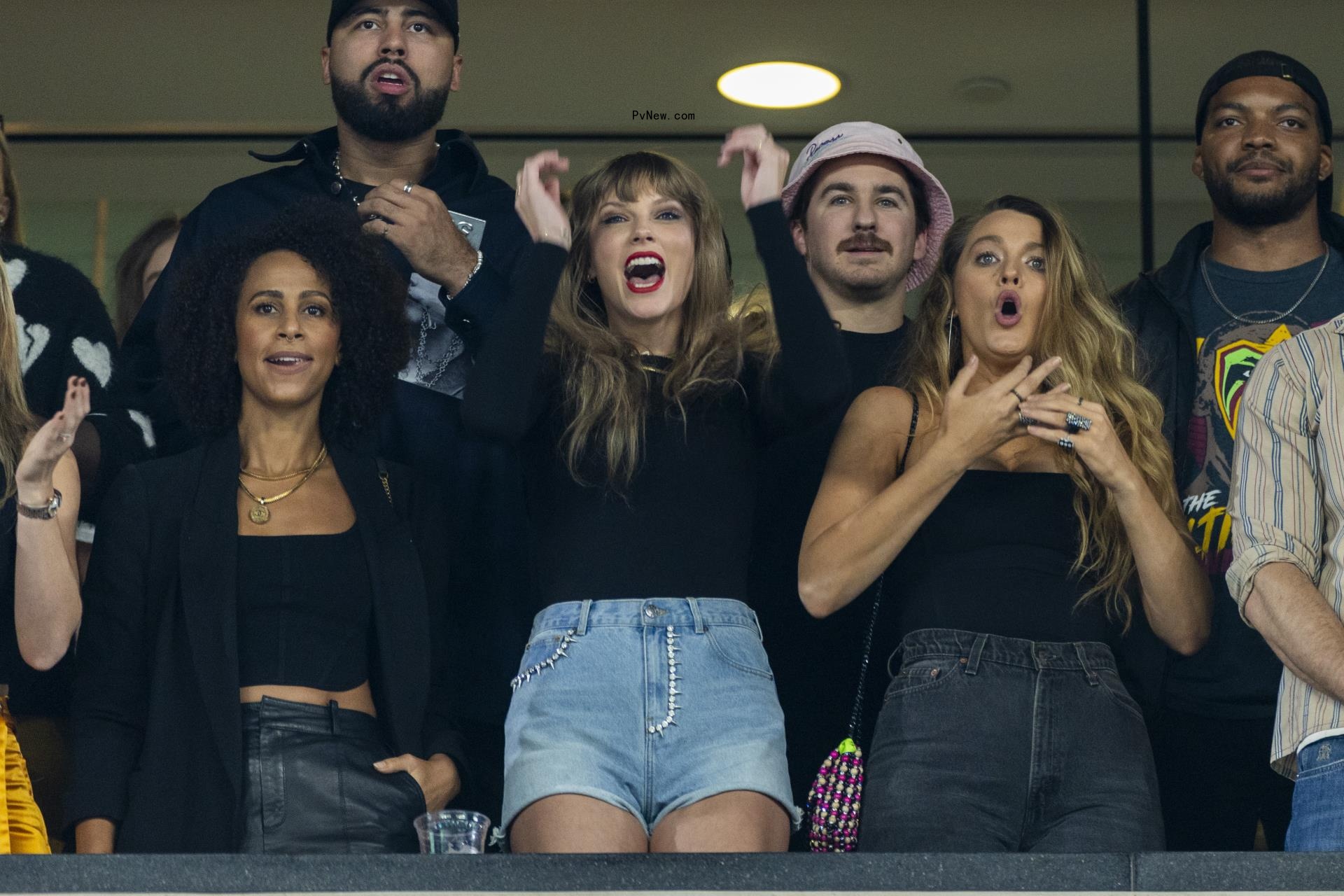 Taylor Swift and Blake Lively cheering at MetLife Stadium