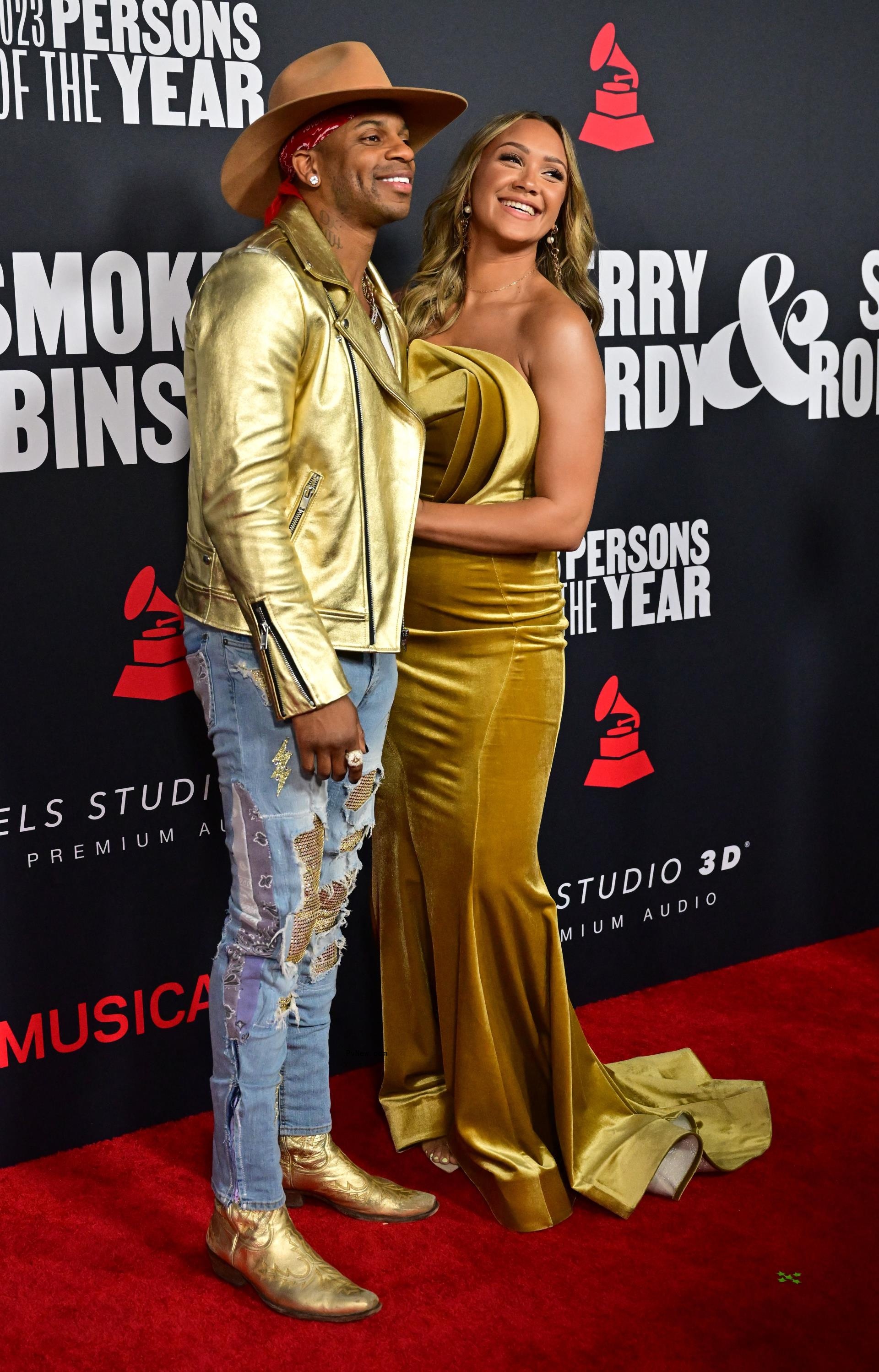 Jimmie Allen and Alexis Gale pose on red carpet