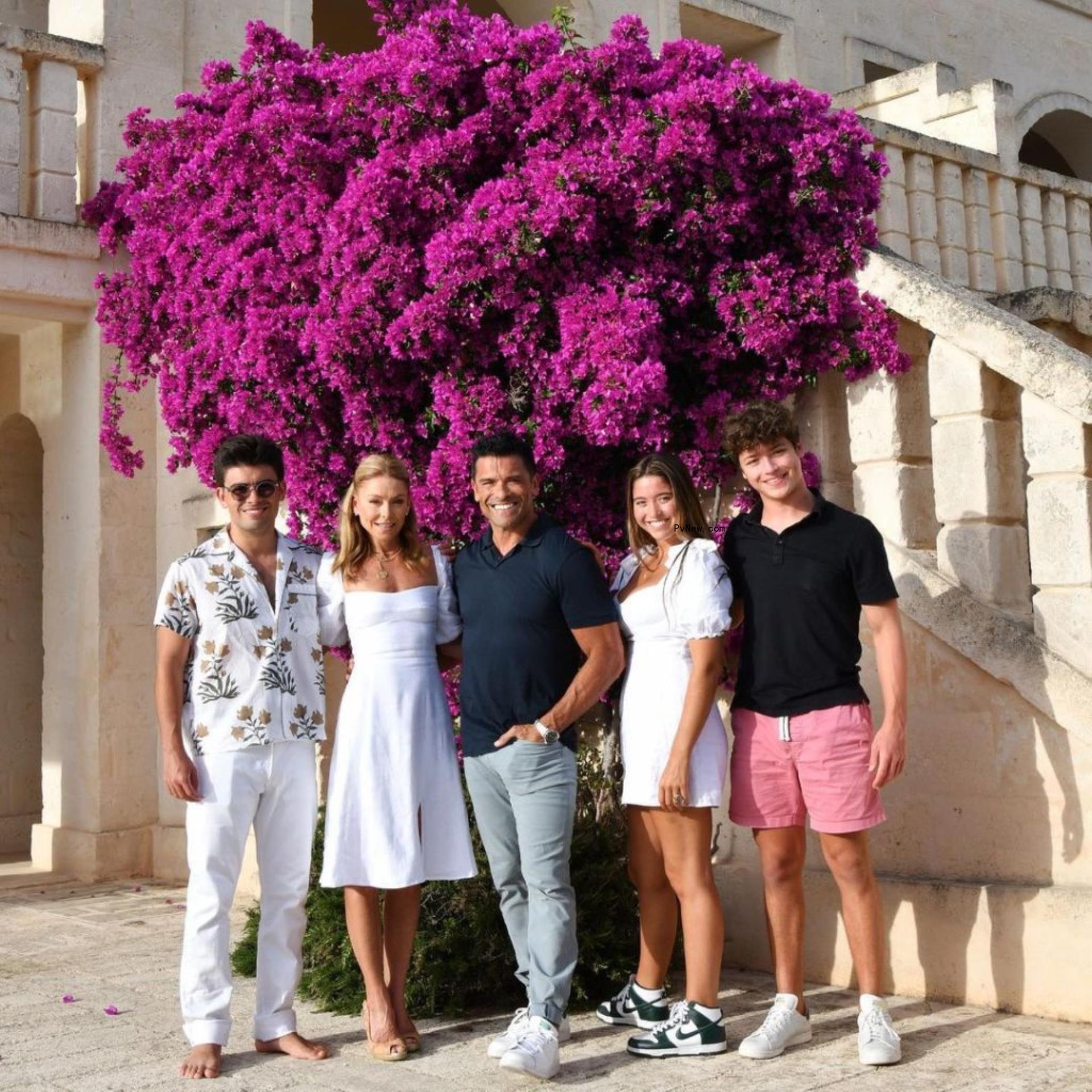 Kelly Ripa and Mark Co<i></i>nsuelos pose with their two sons and one daughter.