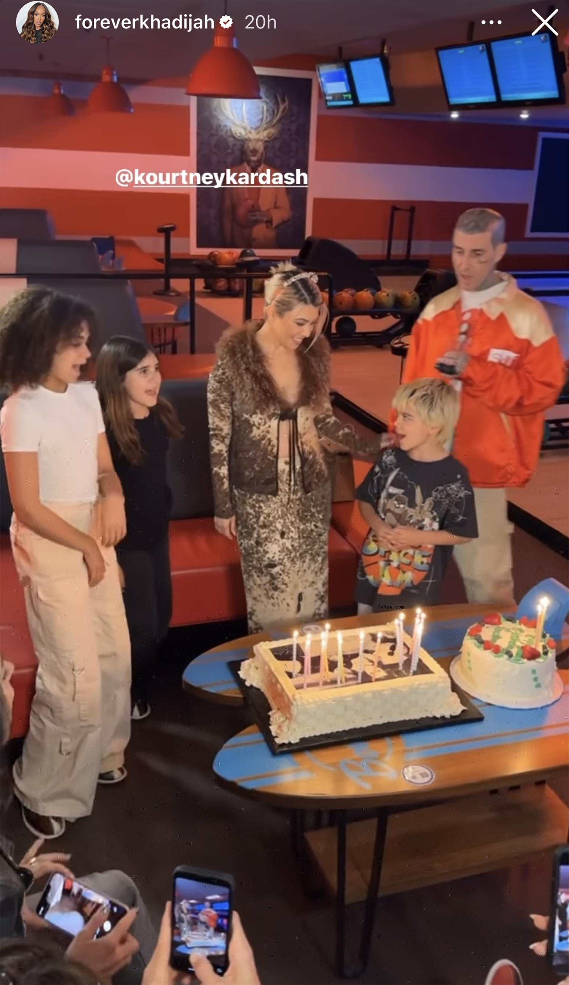 Kourtney kardashian and her family blowing out birthday candles