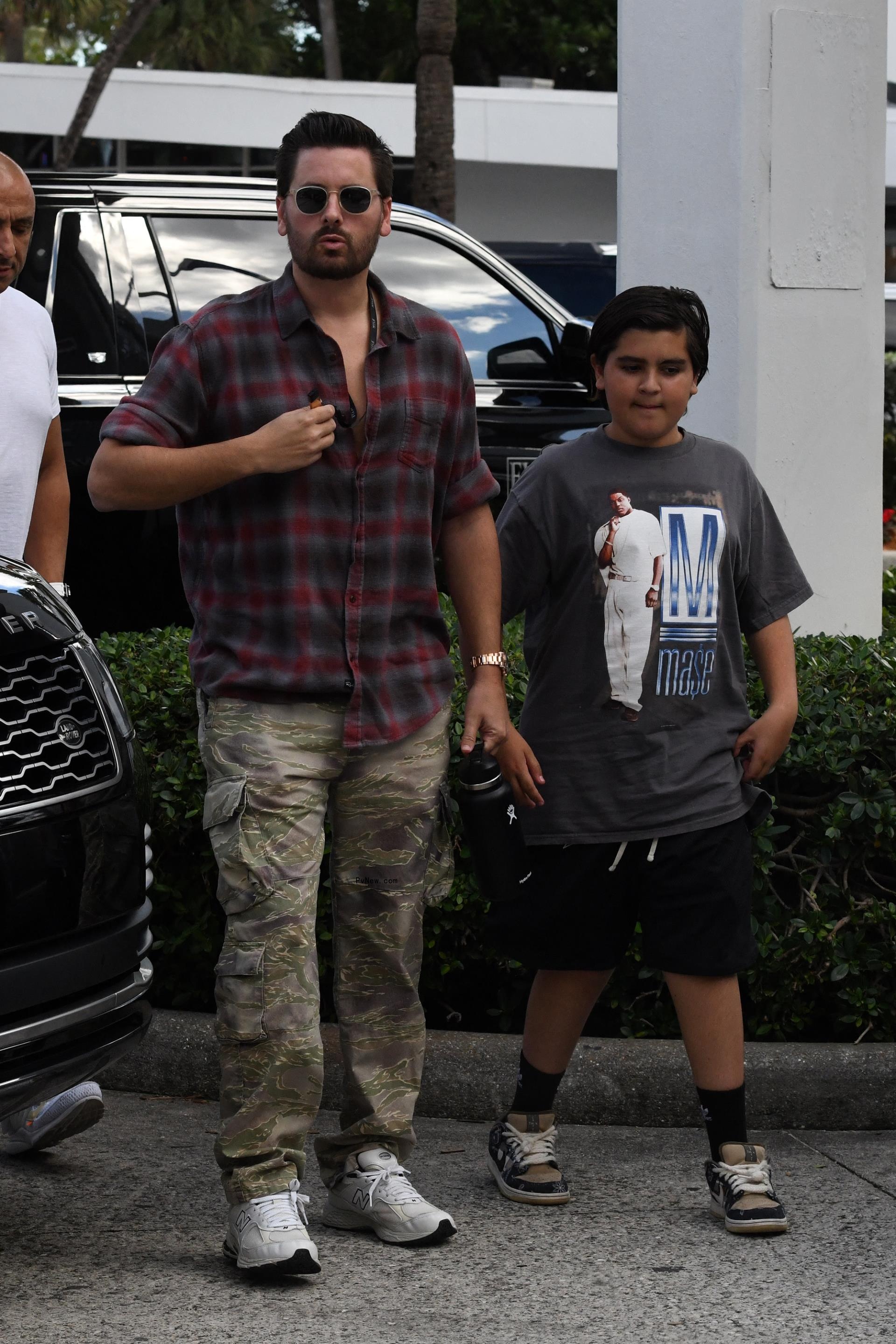 Scott Disick and Mason Disick walking together