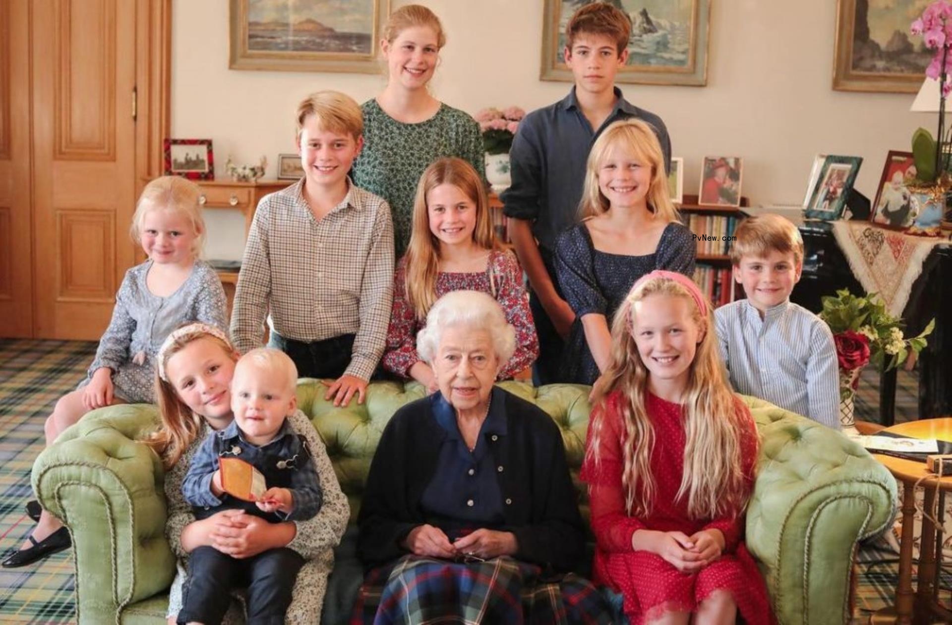 Queen Elizabeth II sits with great-grandkids