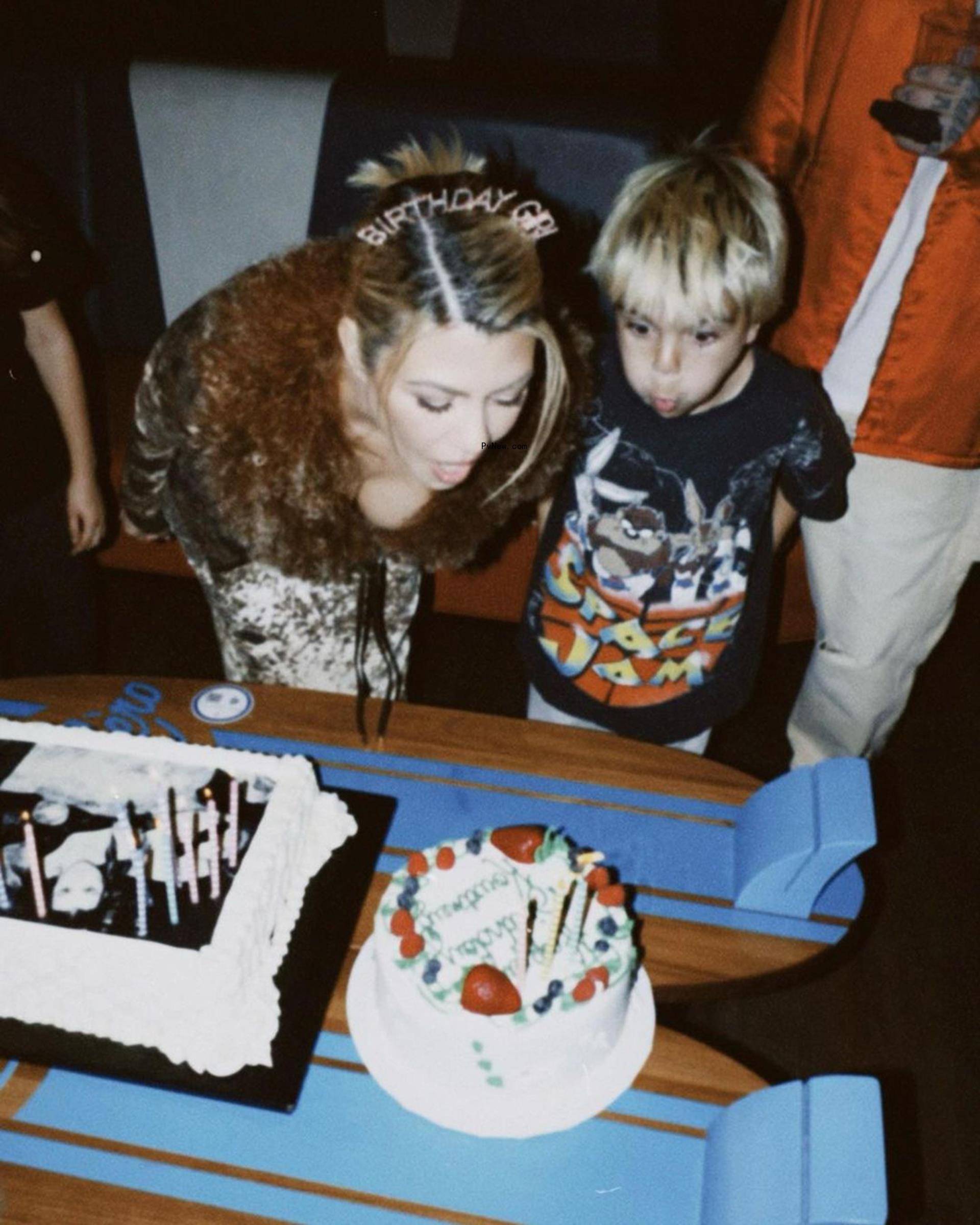 Kourtney Kardashian blowing out birthday candles with Reign Disick