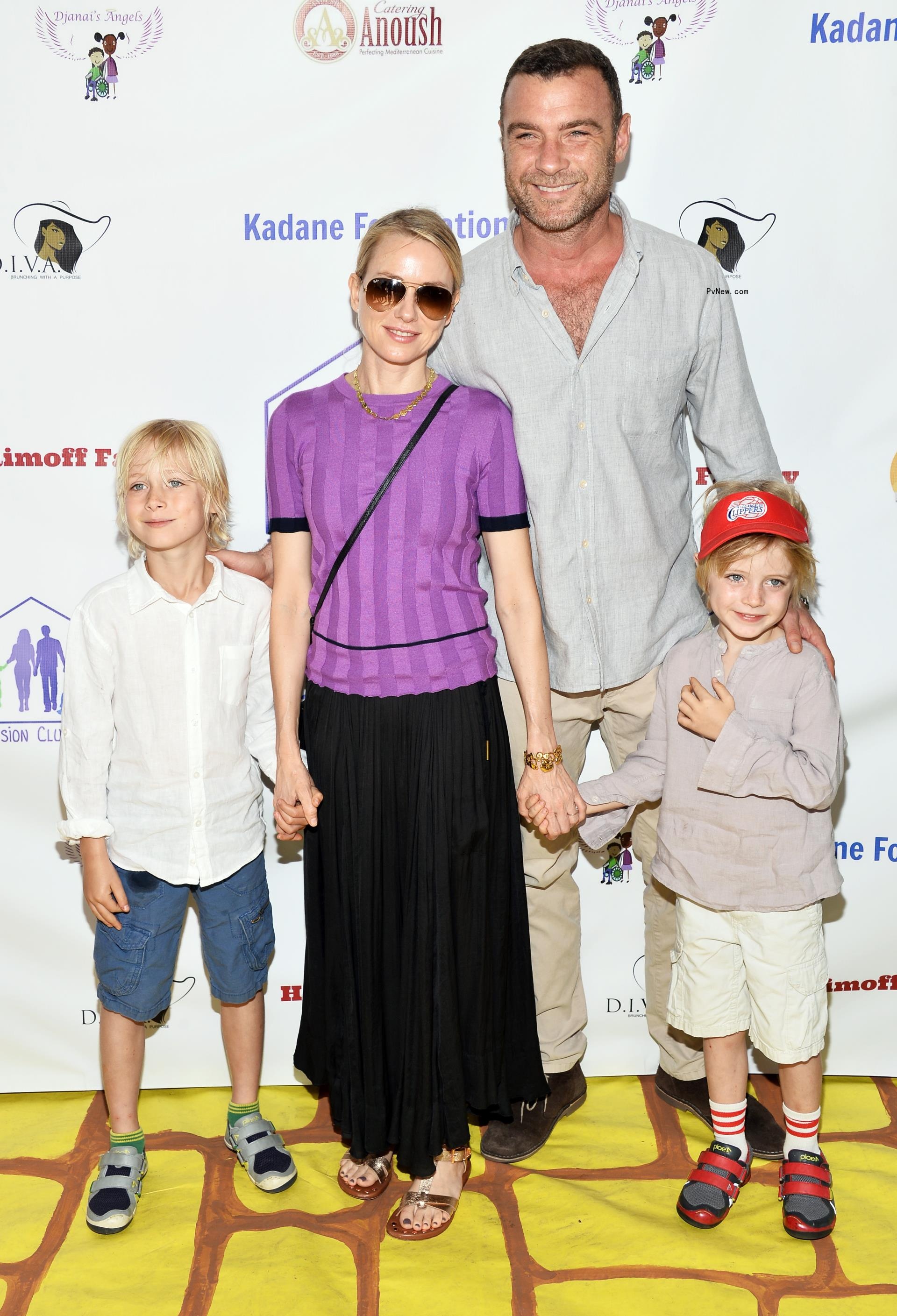 Liev Schreiber and Naomi Watts hold hands with kids on red carpet