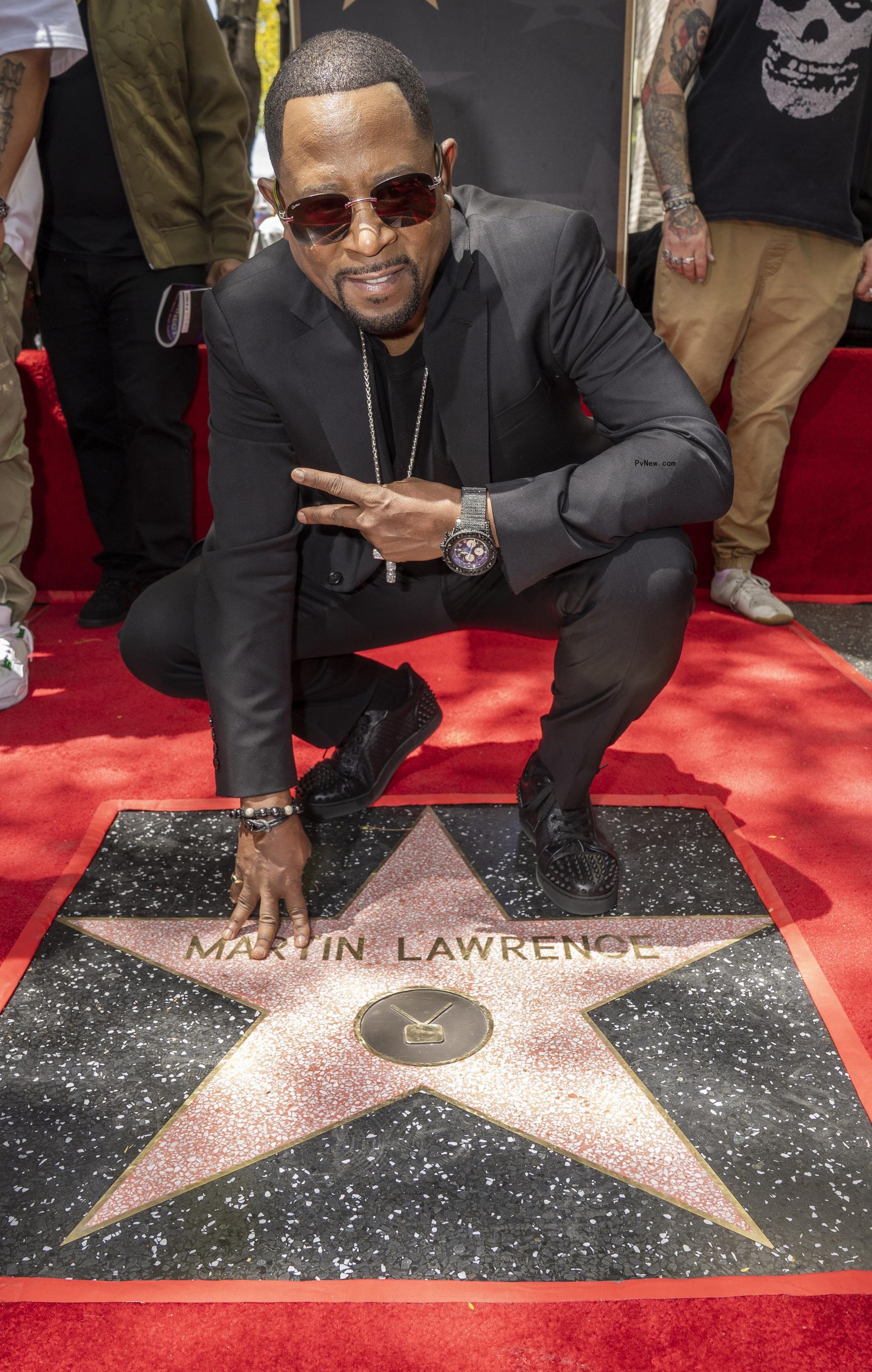 Martin Lawrence poses on Hollywood Walk of Fame