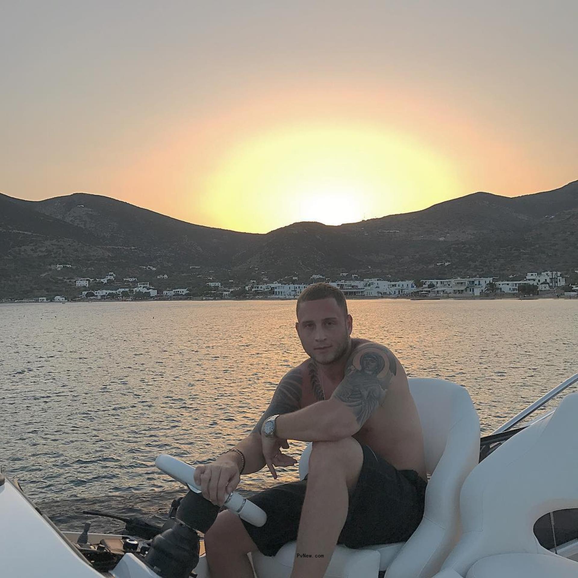 Shirtless Chet Hanks on a boat
