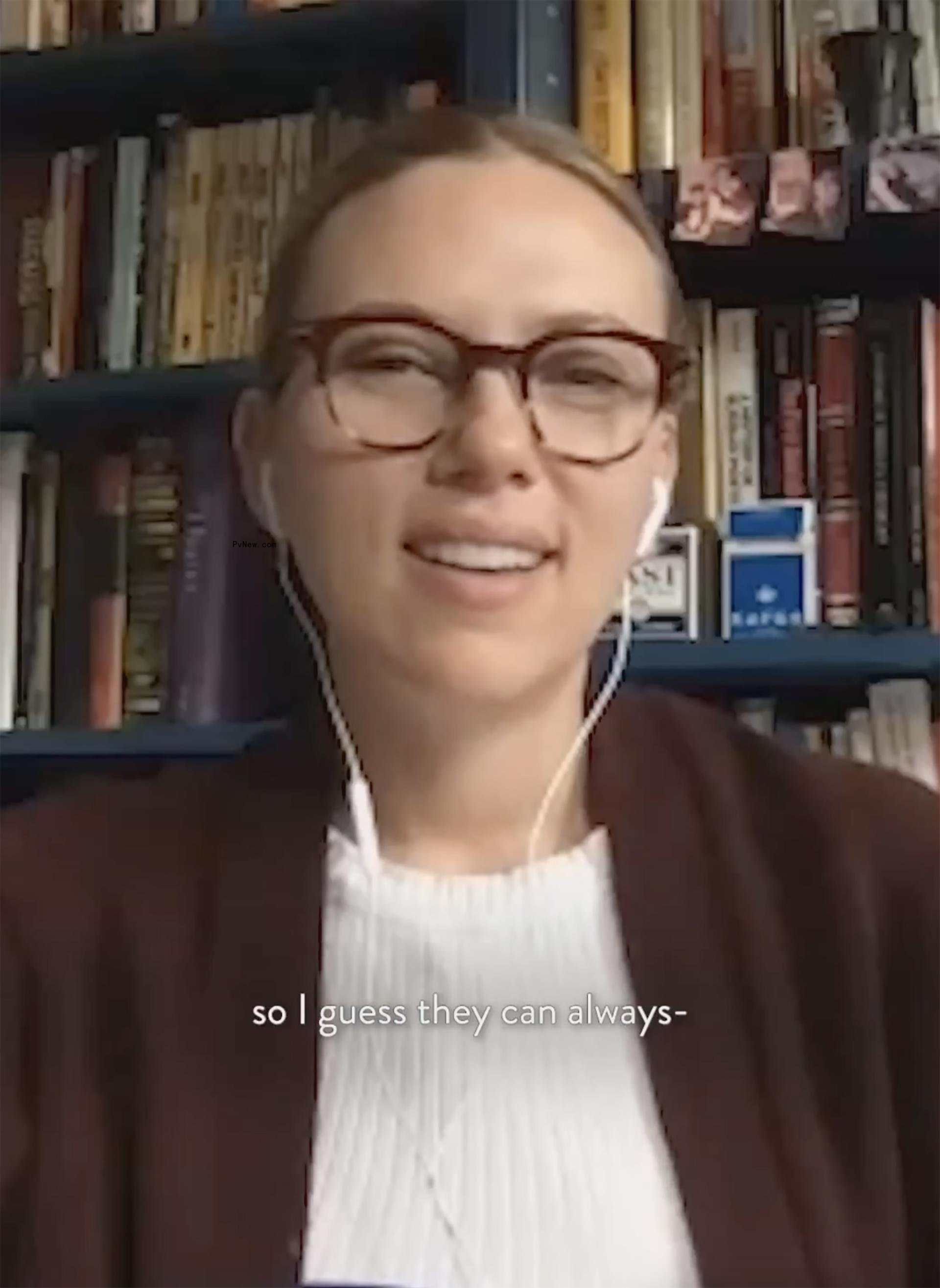 Scarlett Johansson poses in glasses and headphones