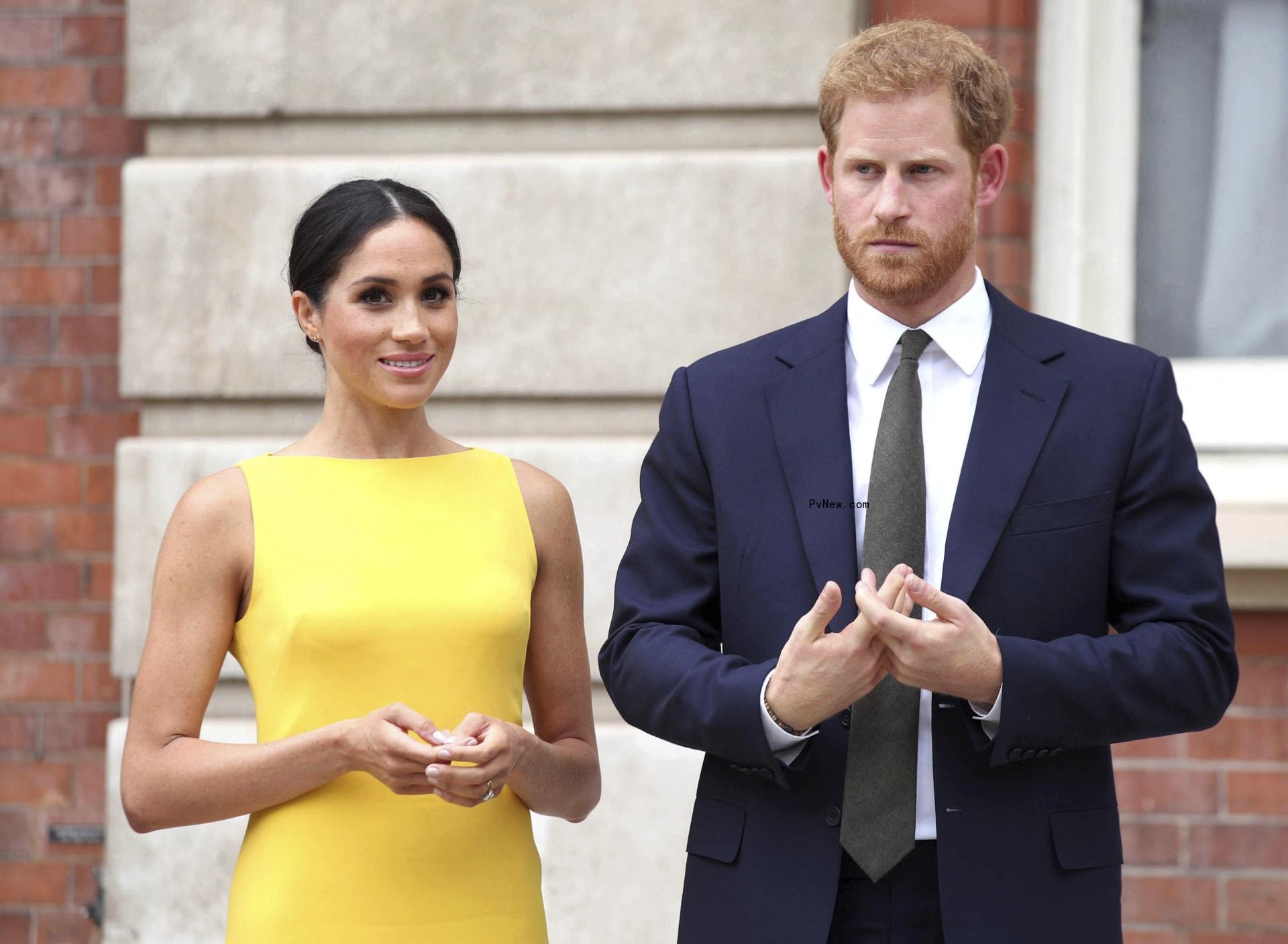 Meghan Markle and Prince Harry standing together.