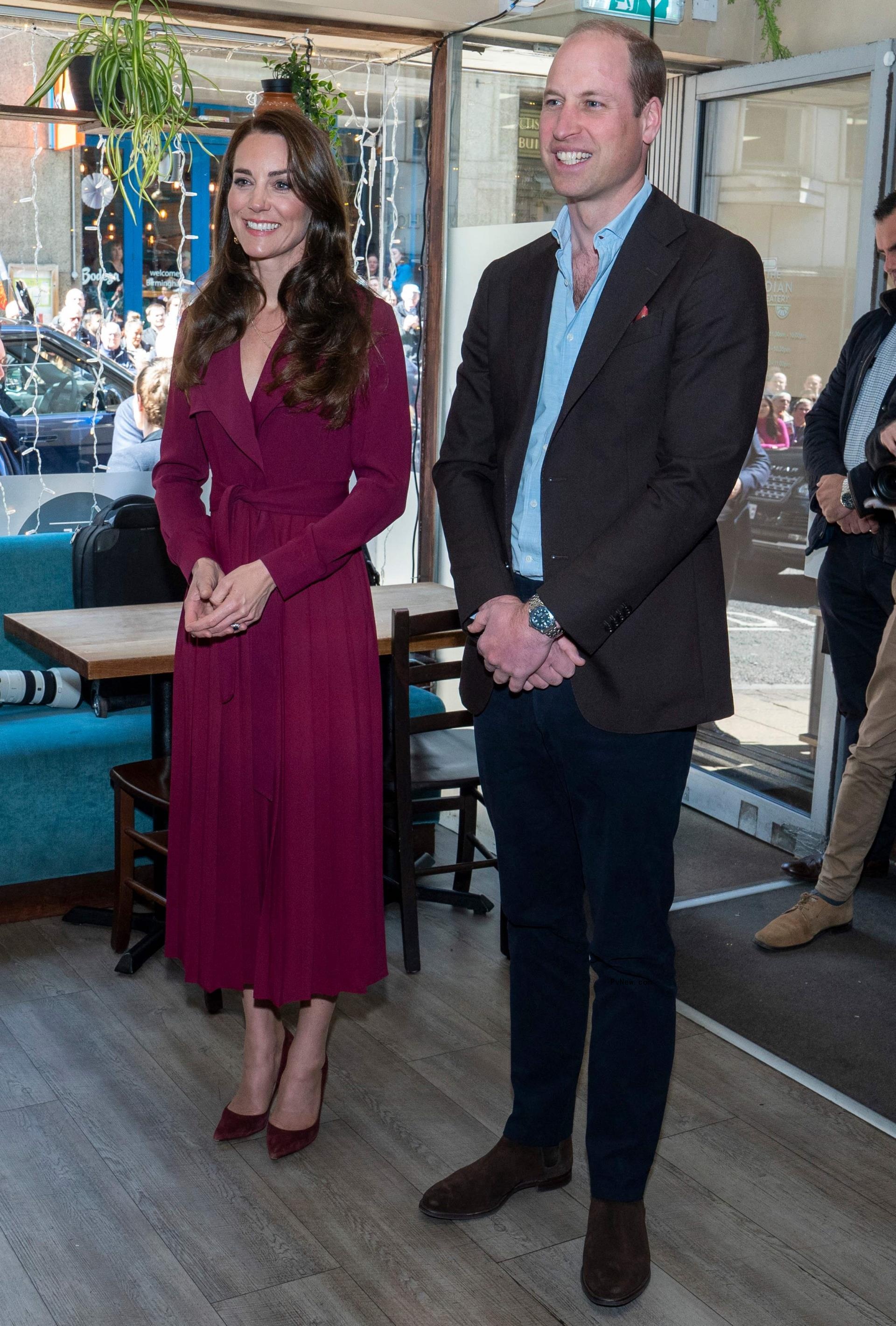 Kate Middleton and Prince William standing together.