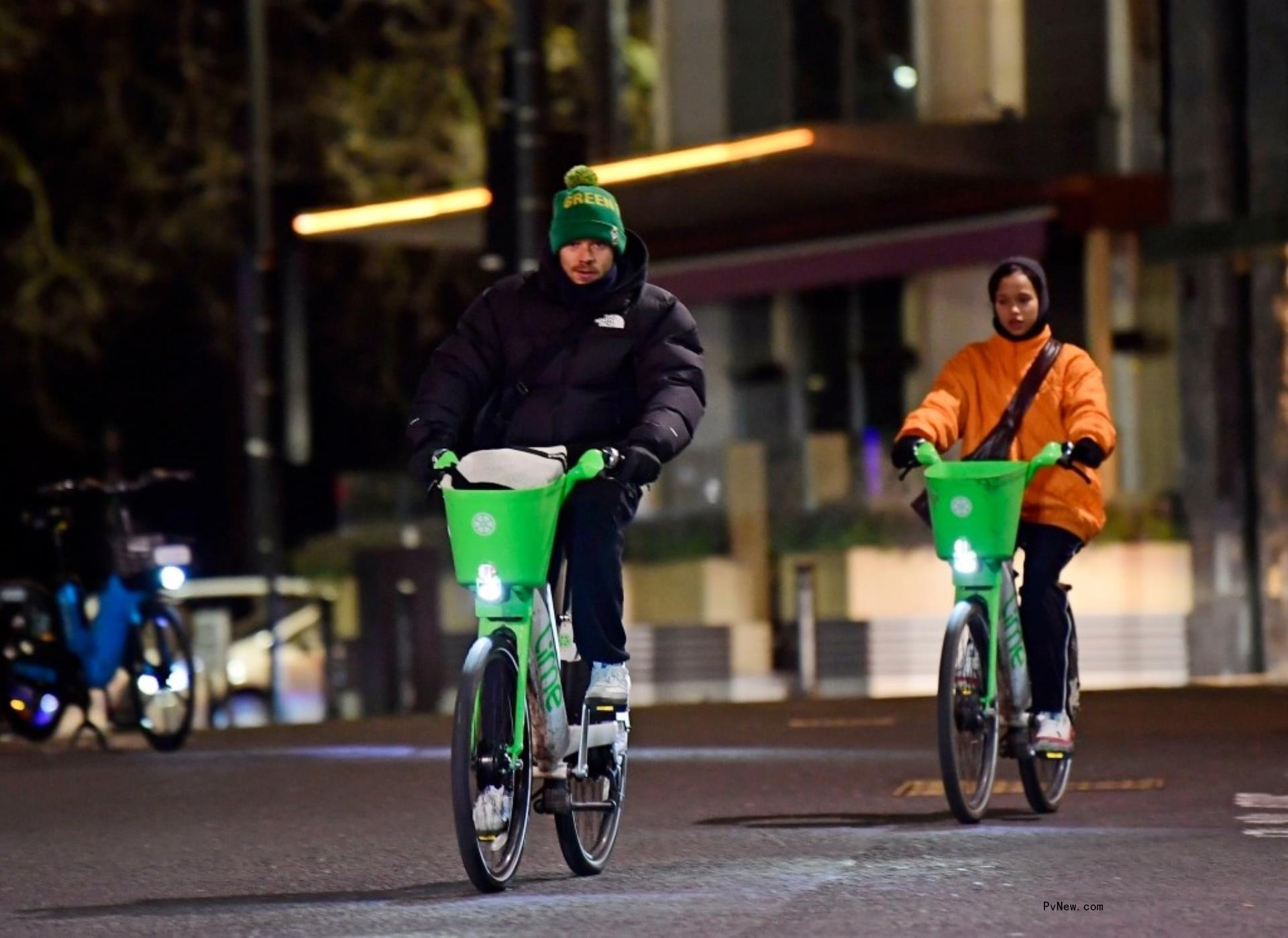 Harry Styles and Taylor Russell biking together