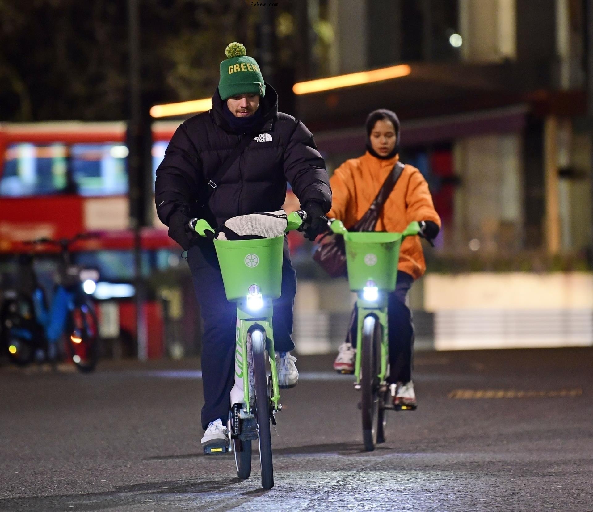 Harry Styles and Taylor Russell biking together