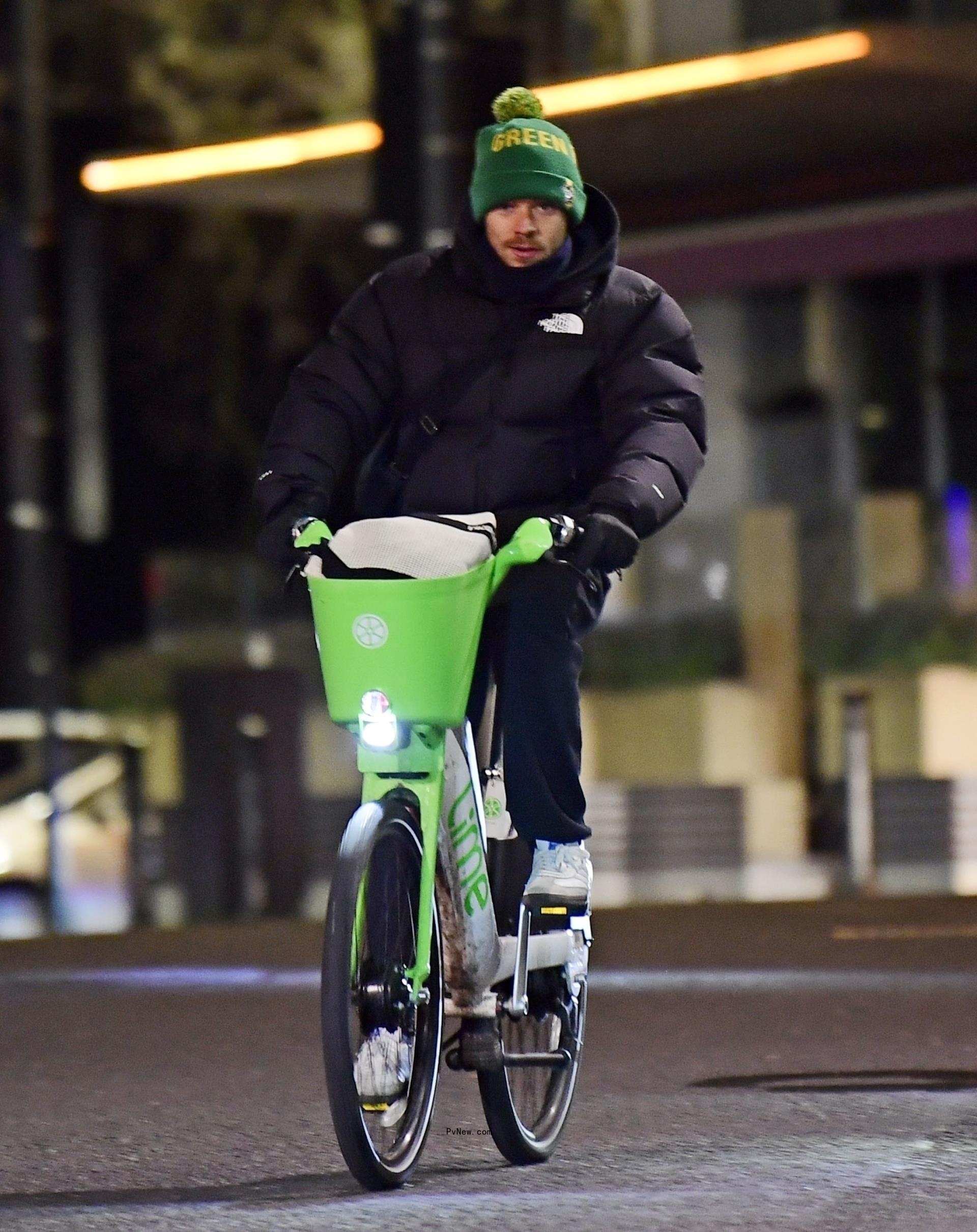 Harry Styles riding a bike