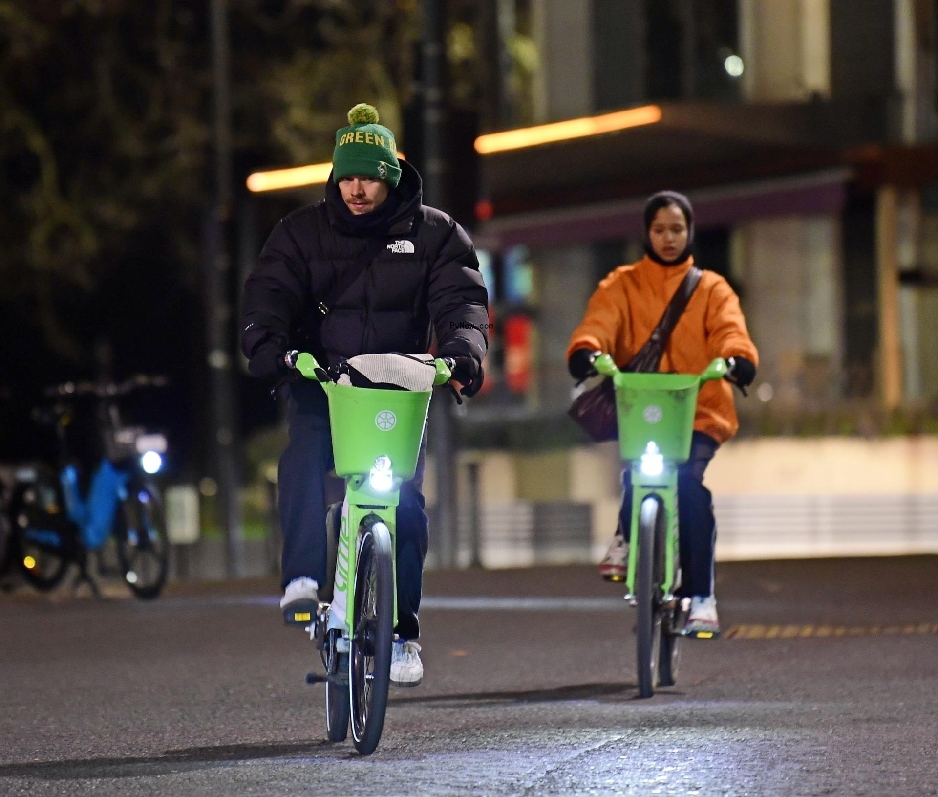 Harry Styles and Taylor Russell biking together