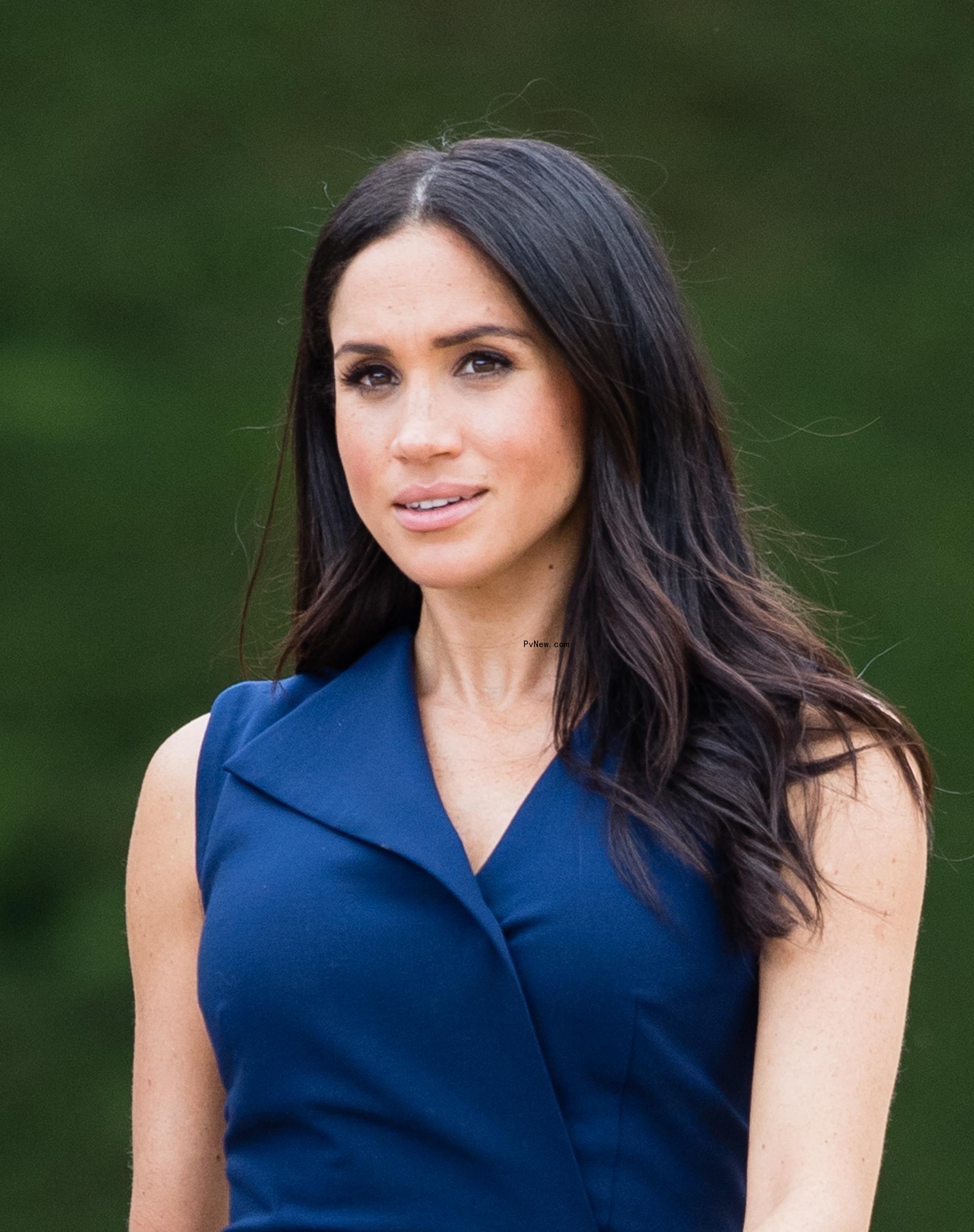 Meghan Markle in a blue top
