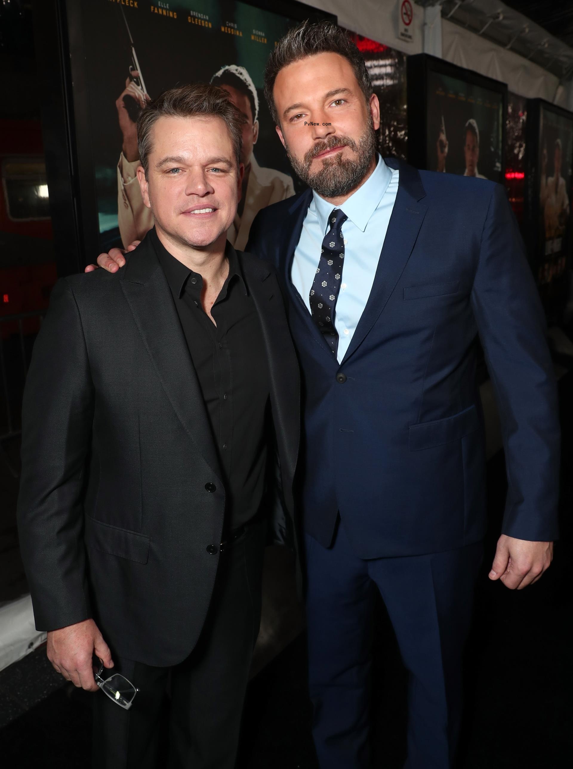 Ben Affleck and Matt Damon posing together at an event.