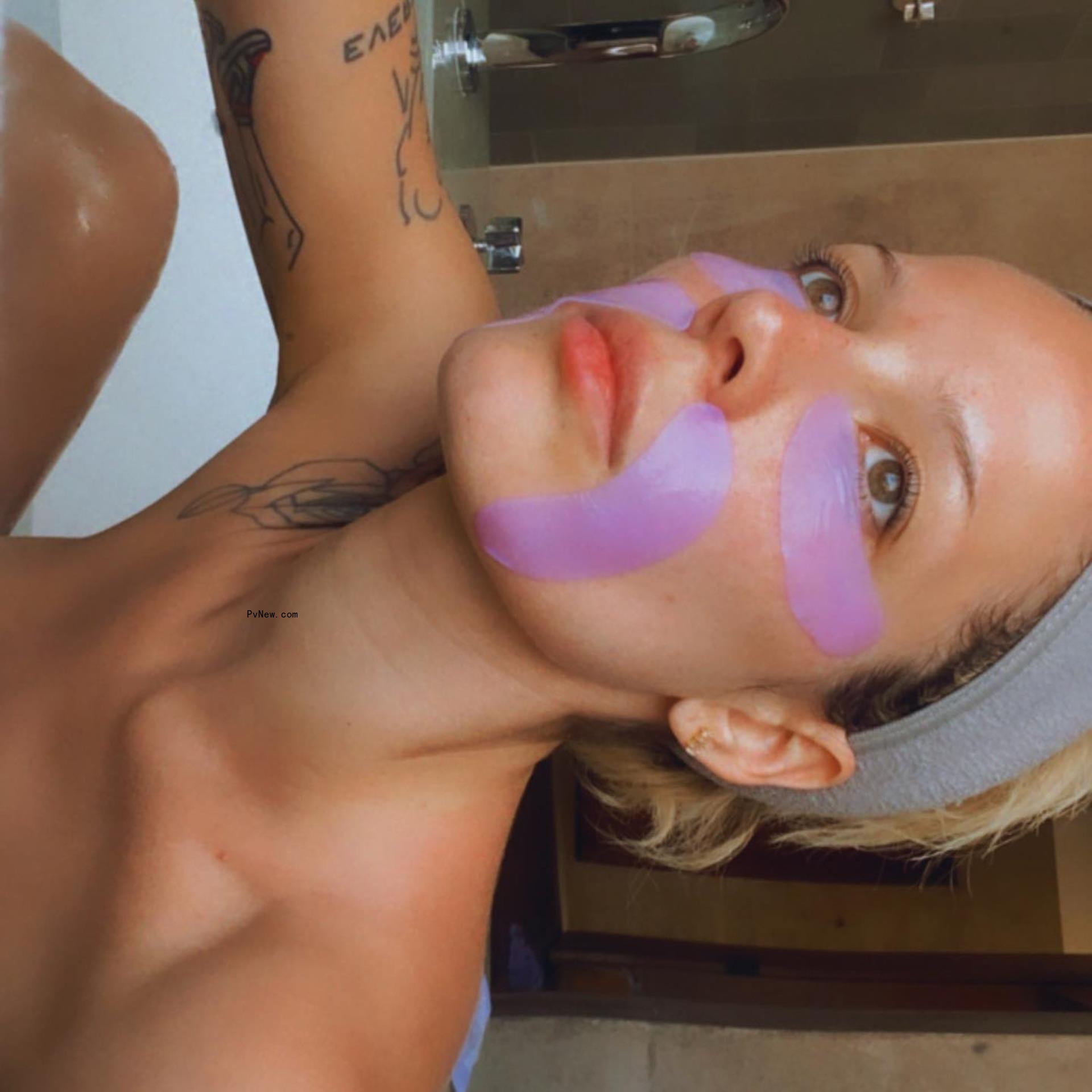 Halsey poses with purple product on face