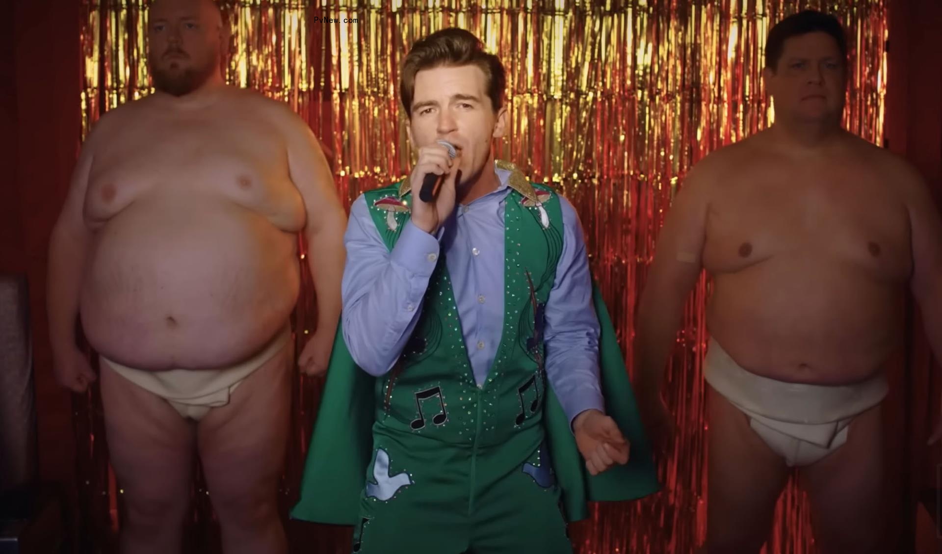 Drake Bell sings with shirtless men in music video