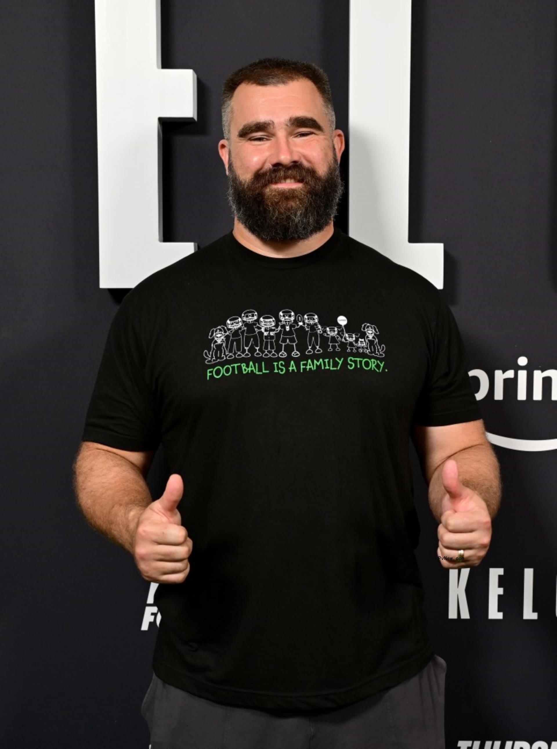 Jason Kelce gives a thumbs up sign in a black t-shirt