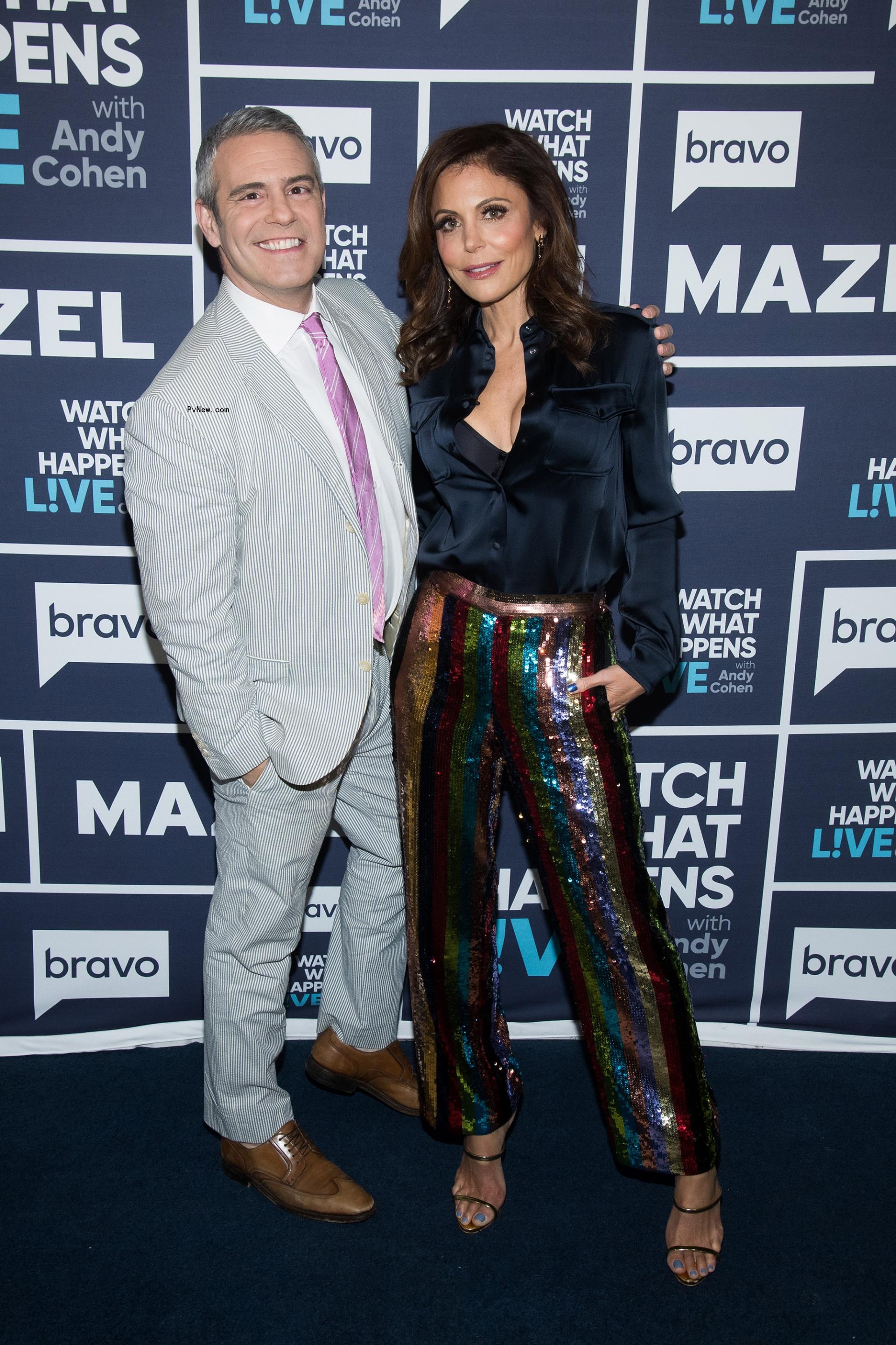 Andy Cohen and Bethenny Frankel posing together 