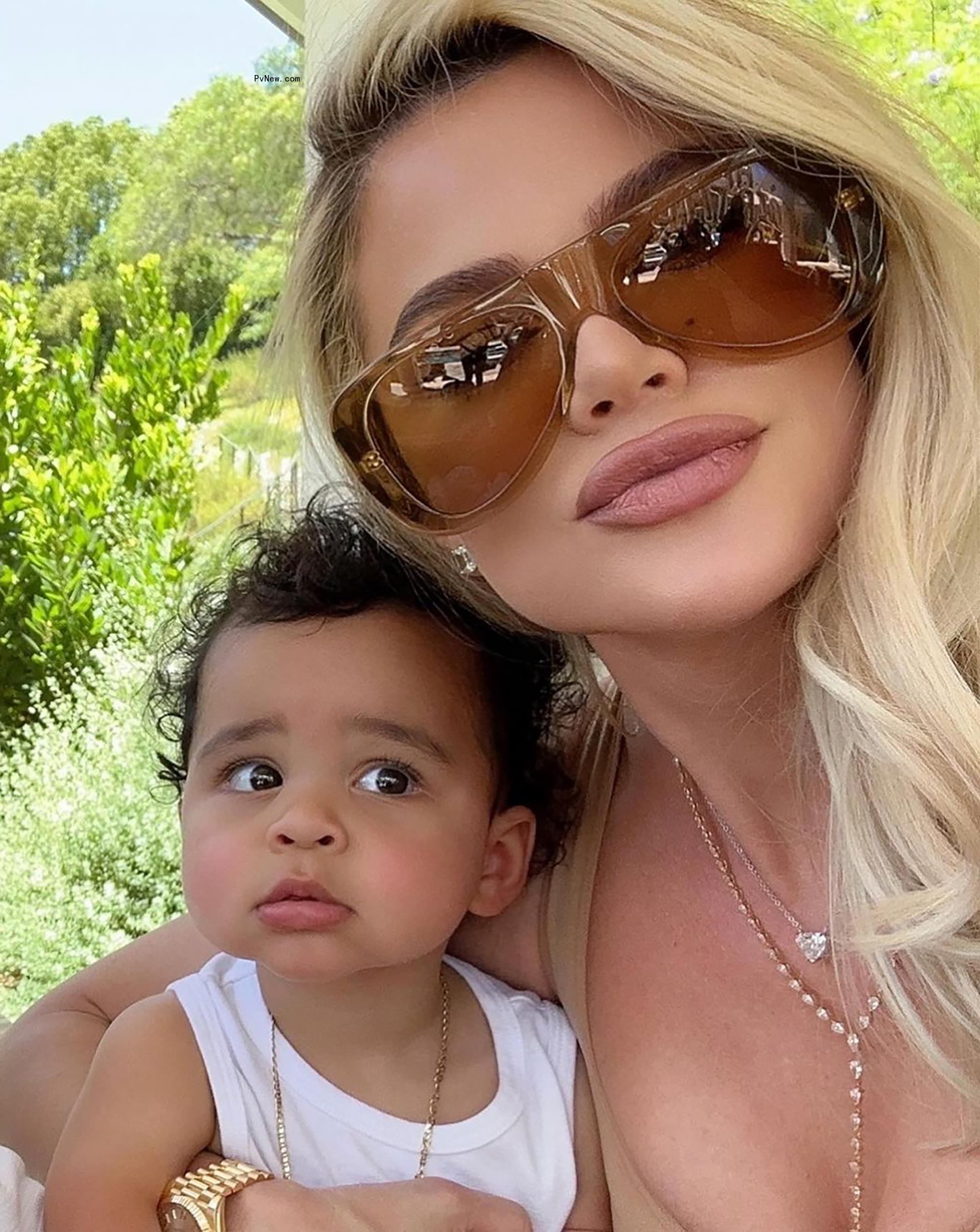 selfie of Khloe Kardashian and Tatum Thompson in white tank