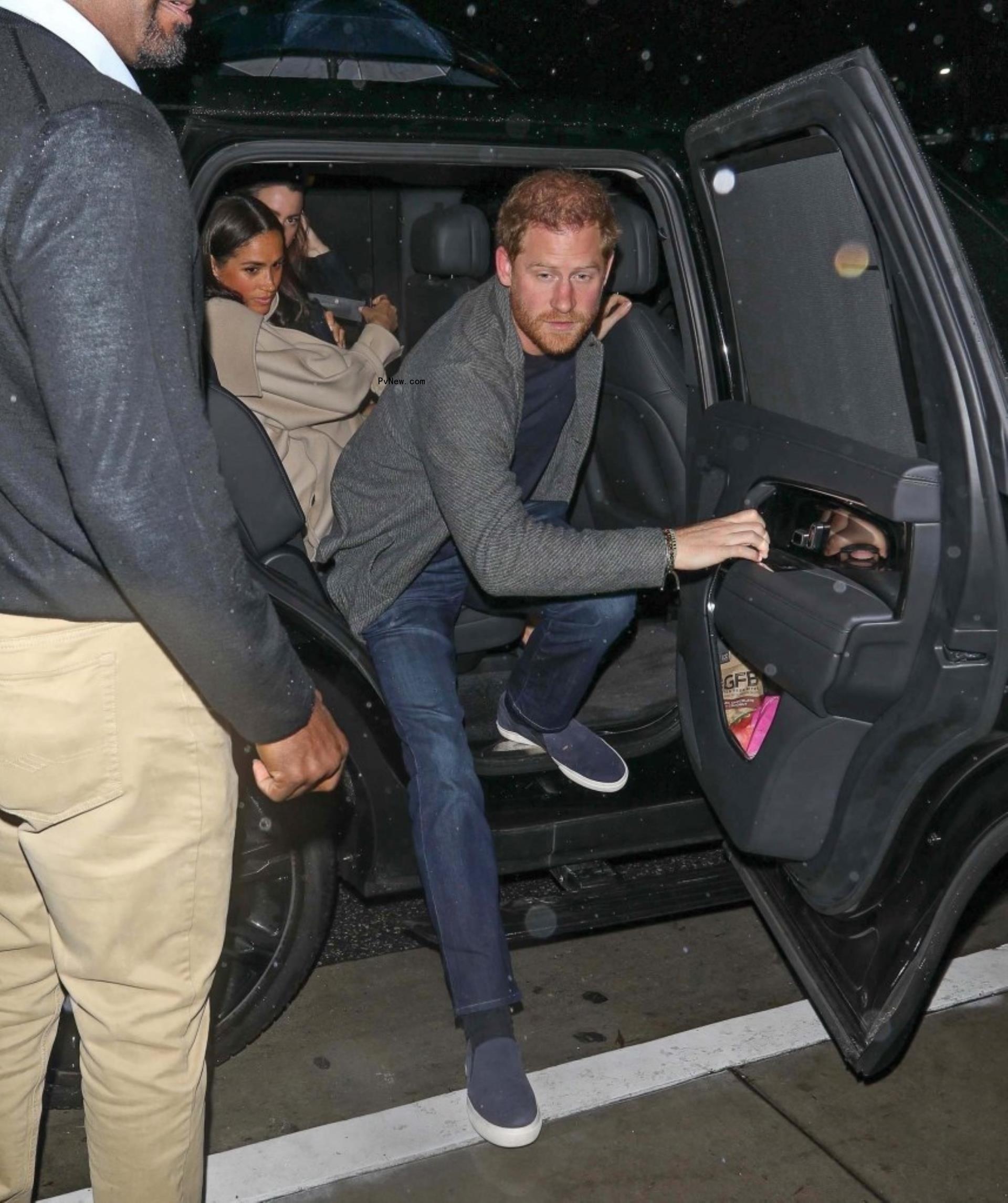 Prince Harry getting out of a car. 