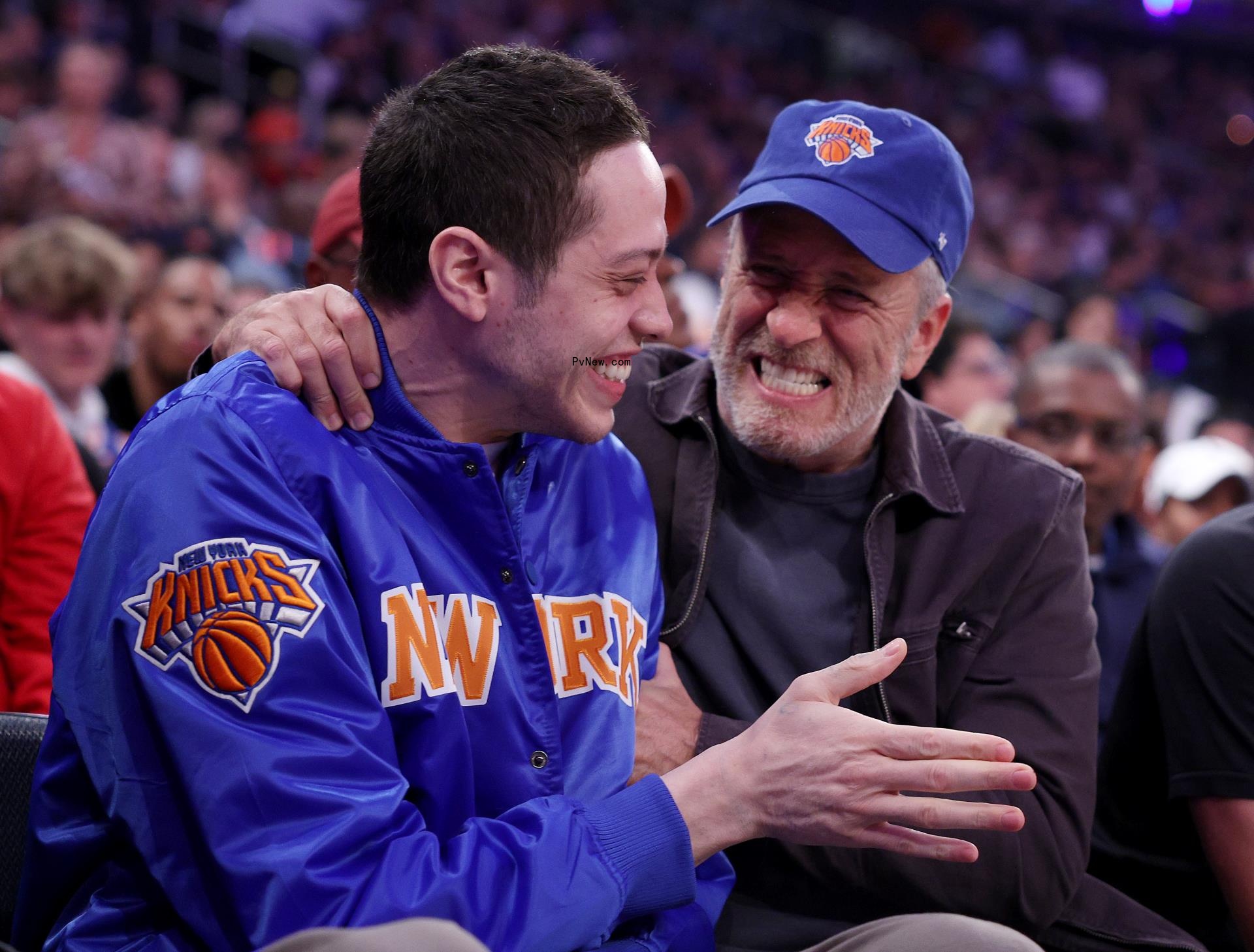 jon stewart with his arm around pete davidson