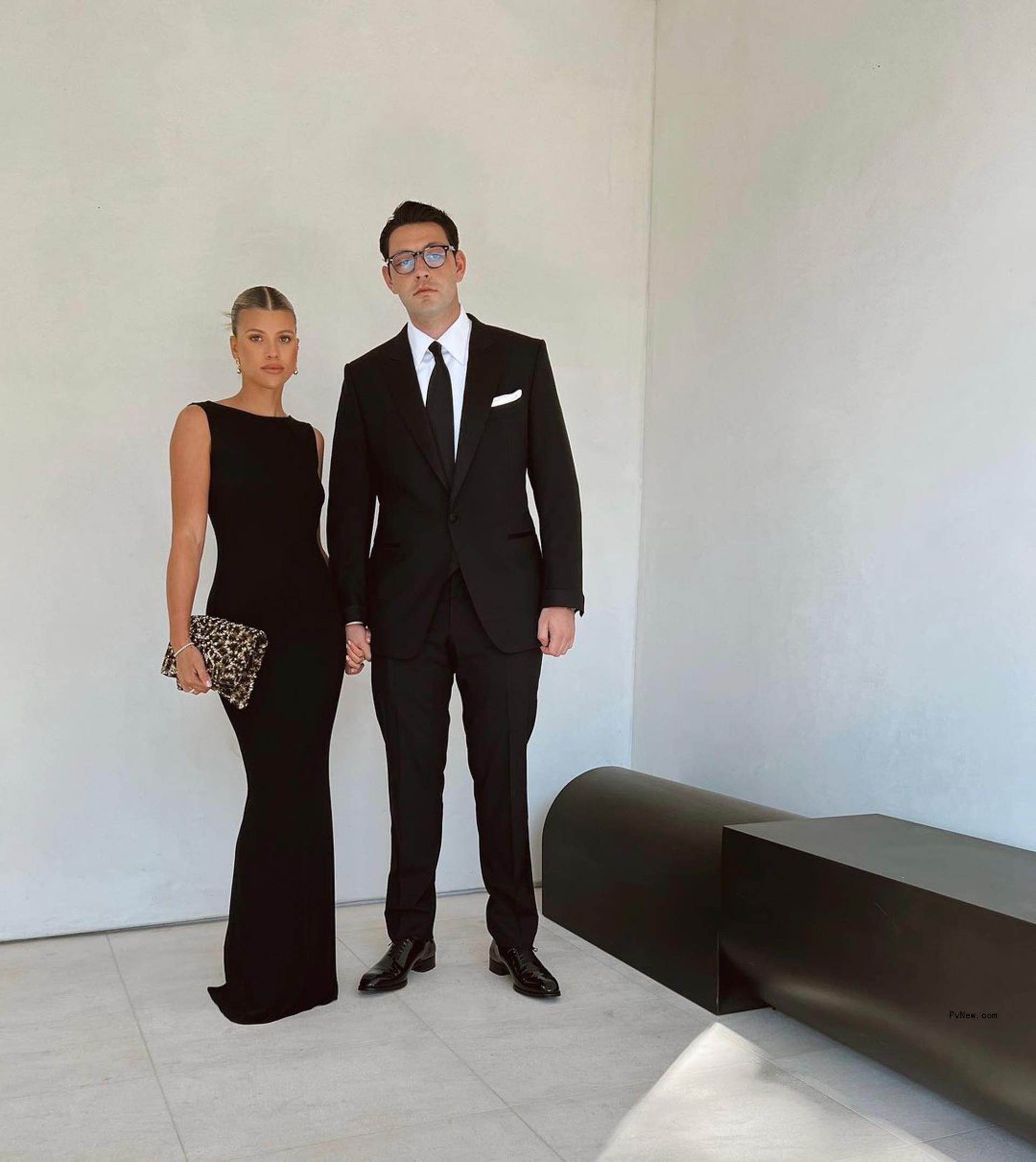Elliot Grainge and Sofia Richie in formal attire.