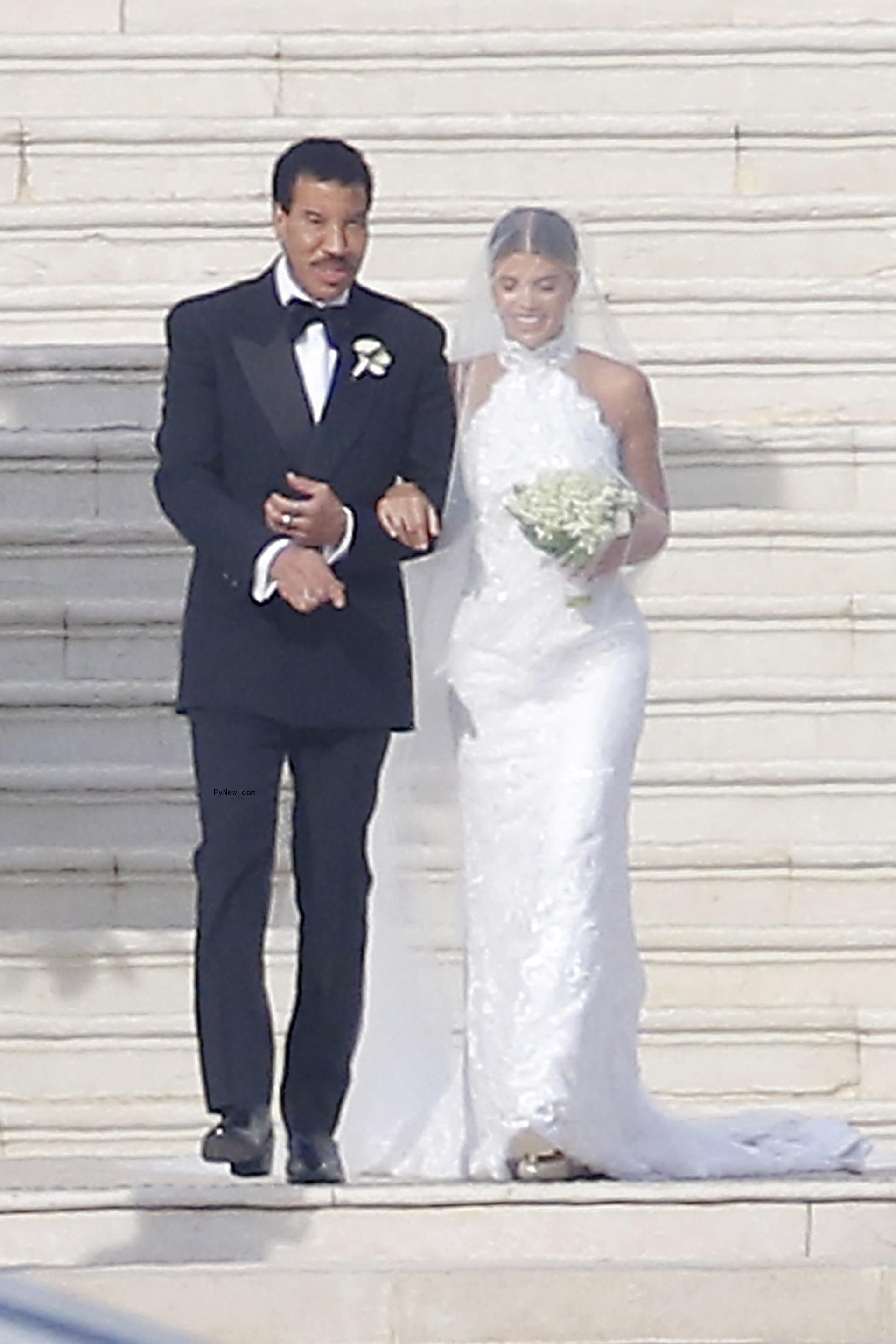 Sofia Richie walking down the aisle with Lio<i></i>nel Richie.