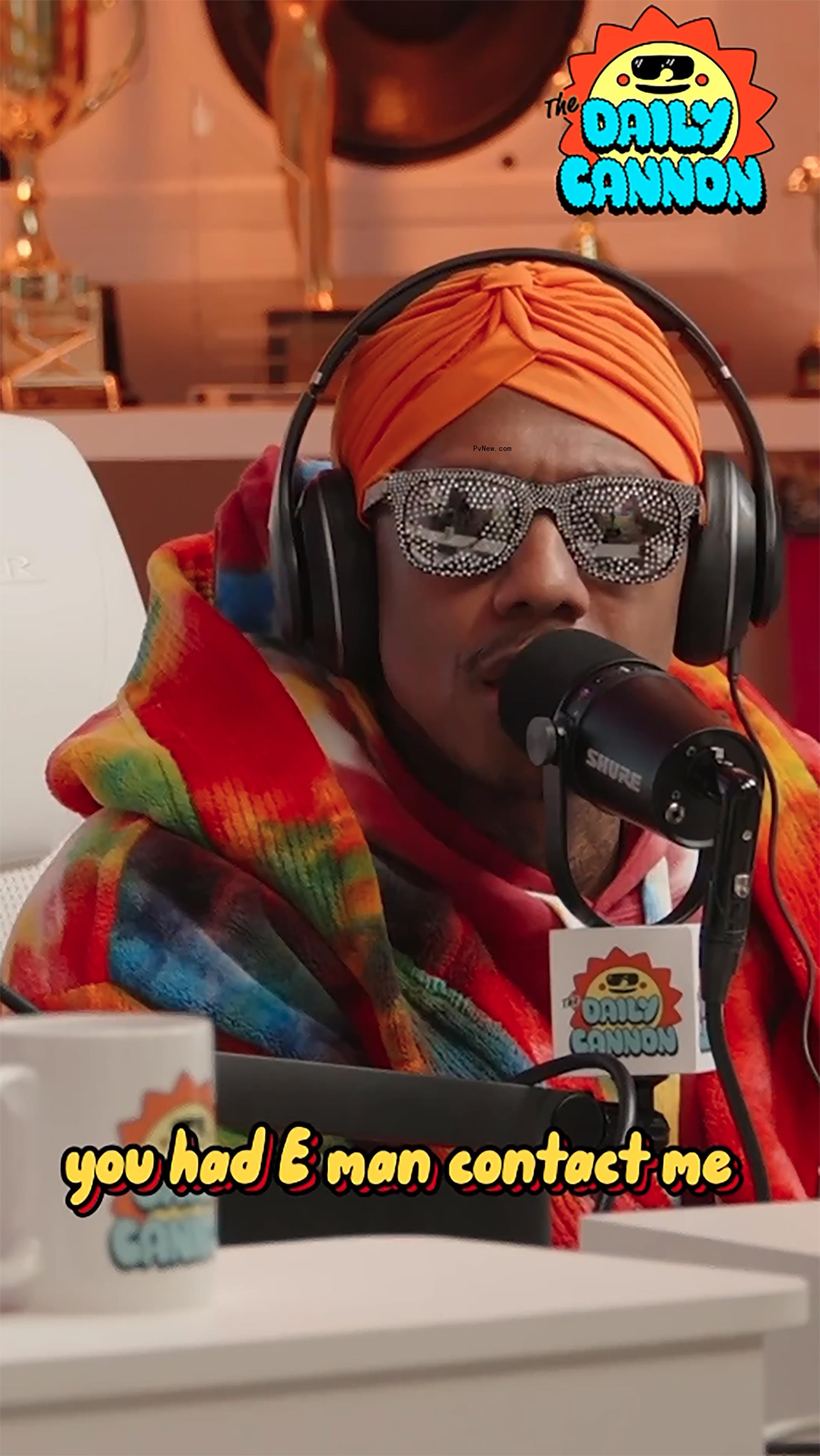 Nick Cannon talks into mic