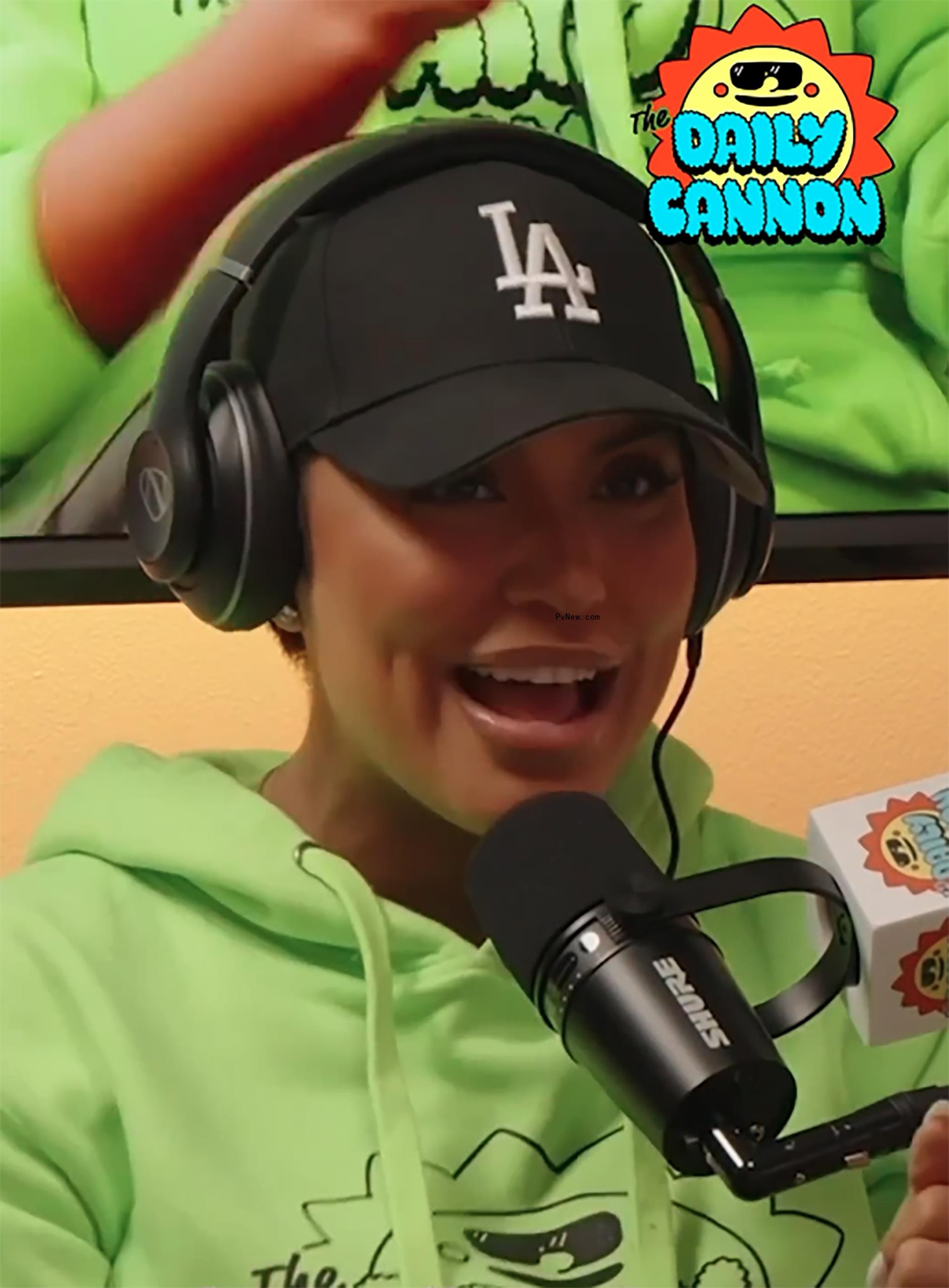 Abby De La Rosa talks into mic