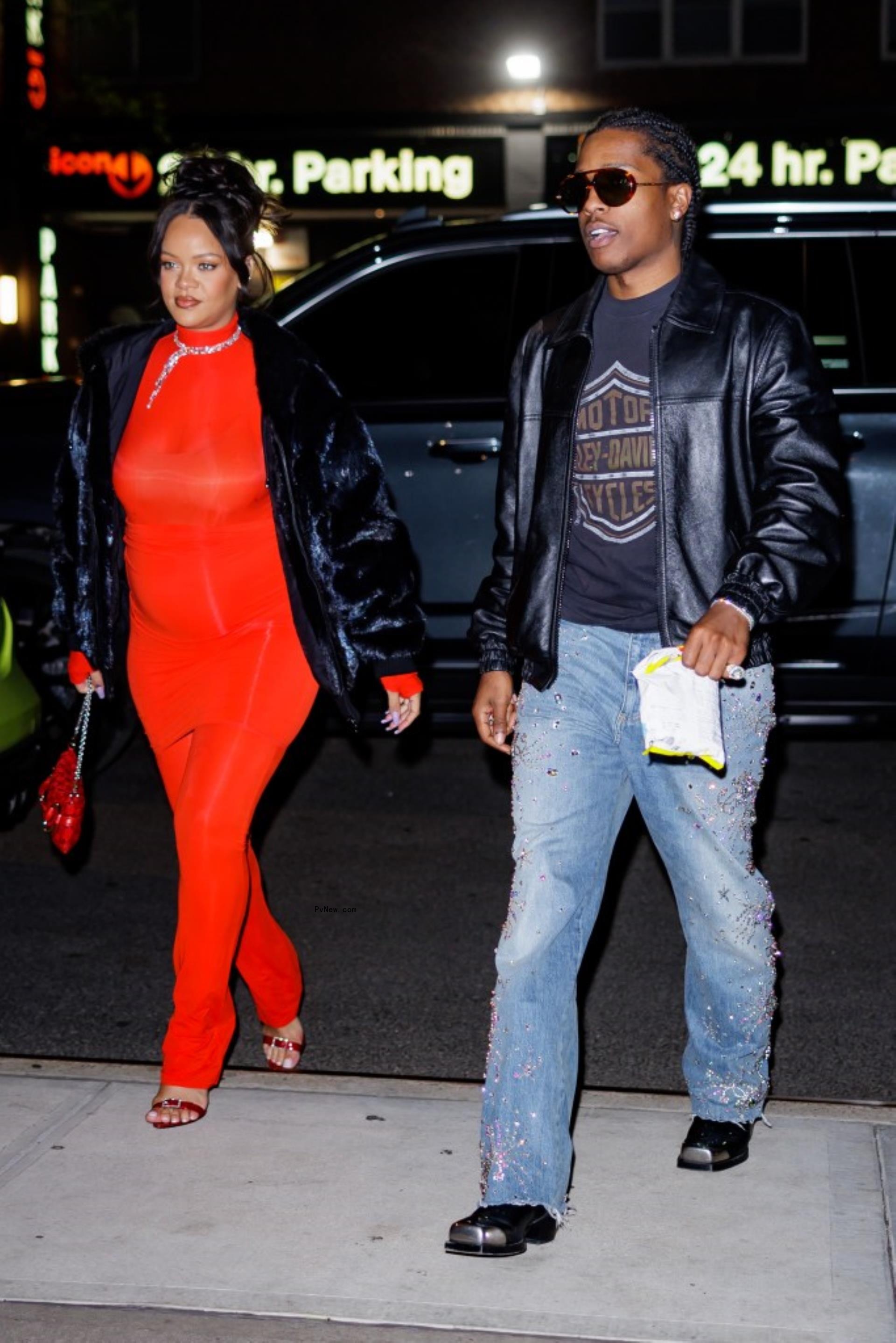 Pregnant Rihanna walking in New York City in a red outfit with A$AP Rocky.