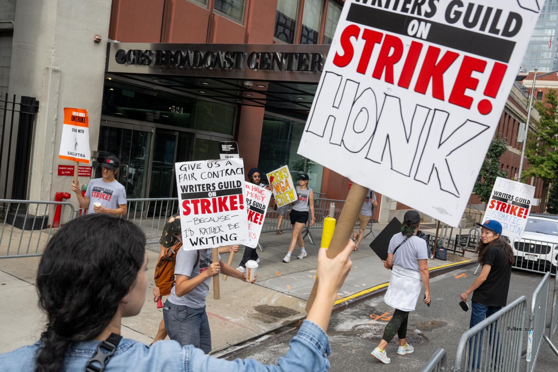 WGA picketers holding signs.