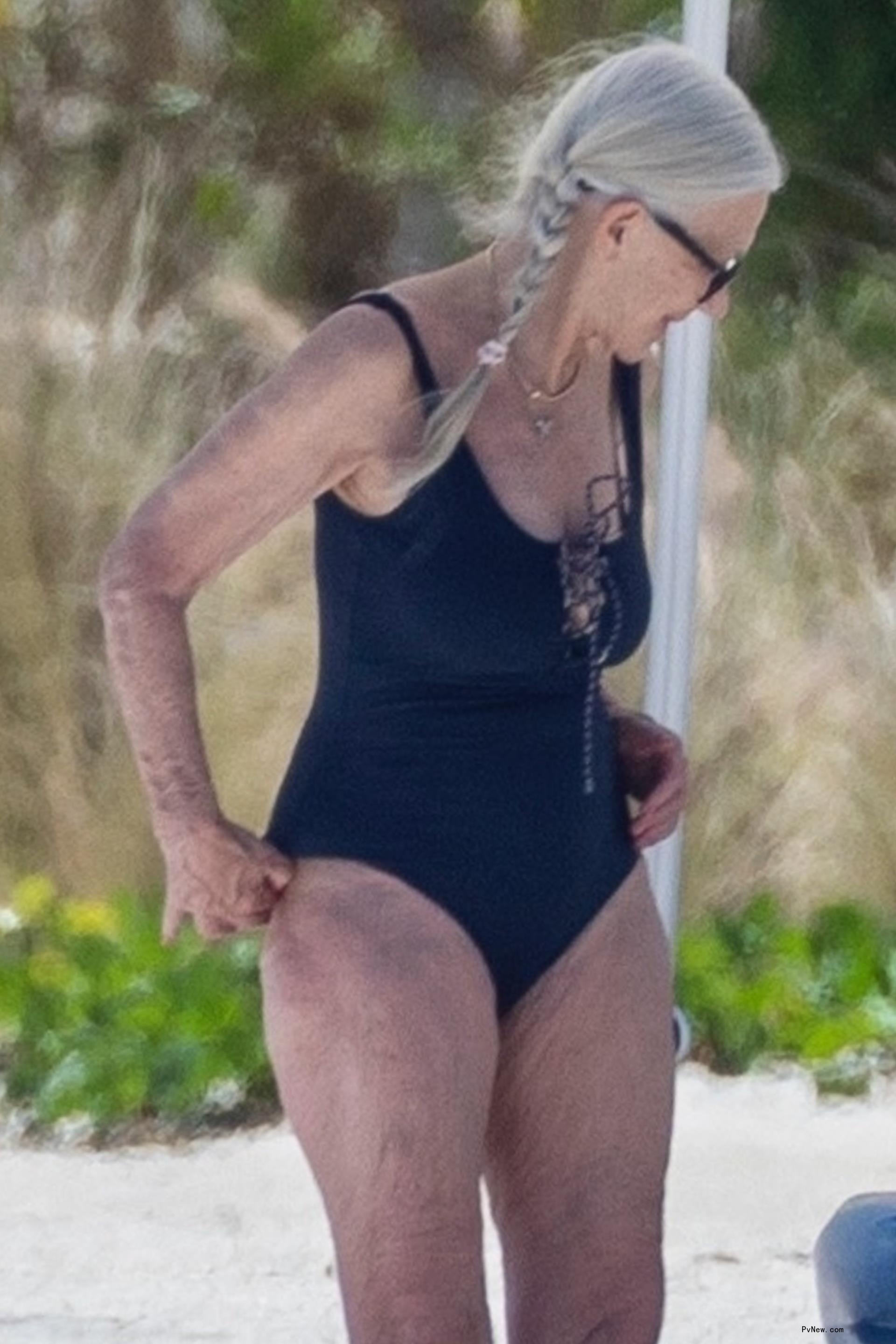 Helen Mirren in a black swimsuit.