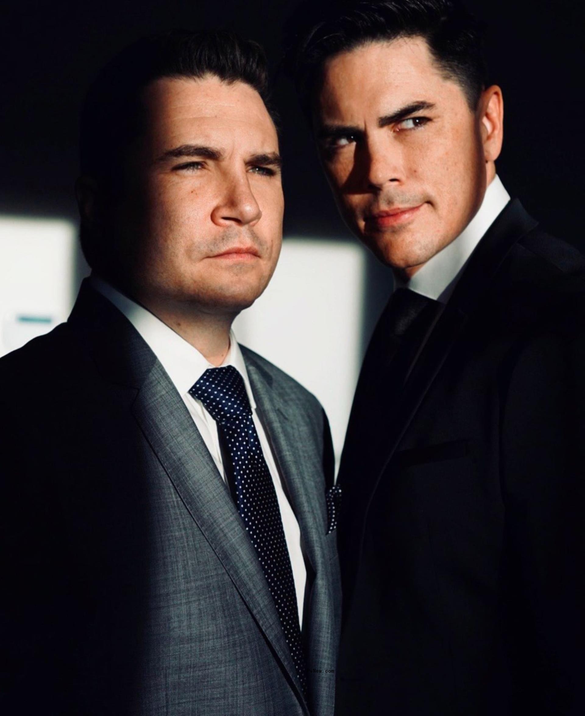 Tom Sandoval and his brother, Brian Sandoval, posing together in suits.