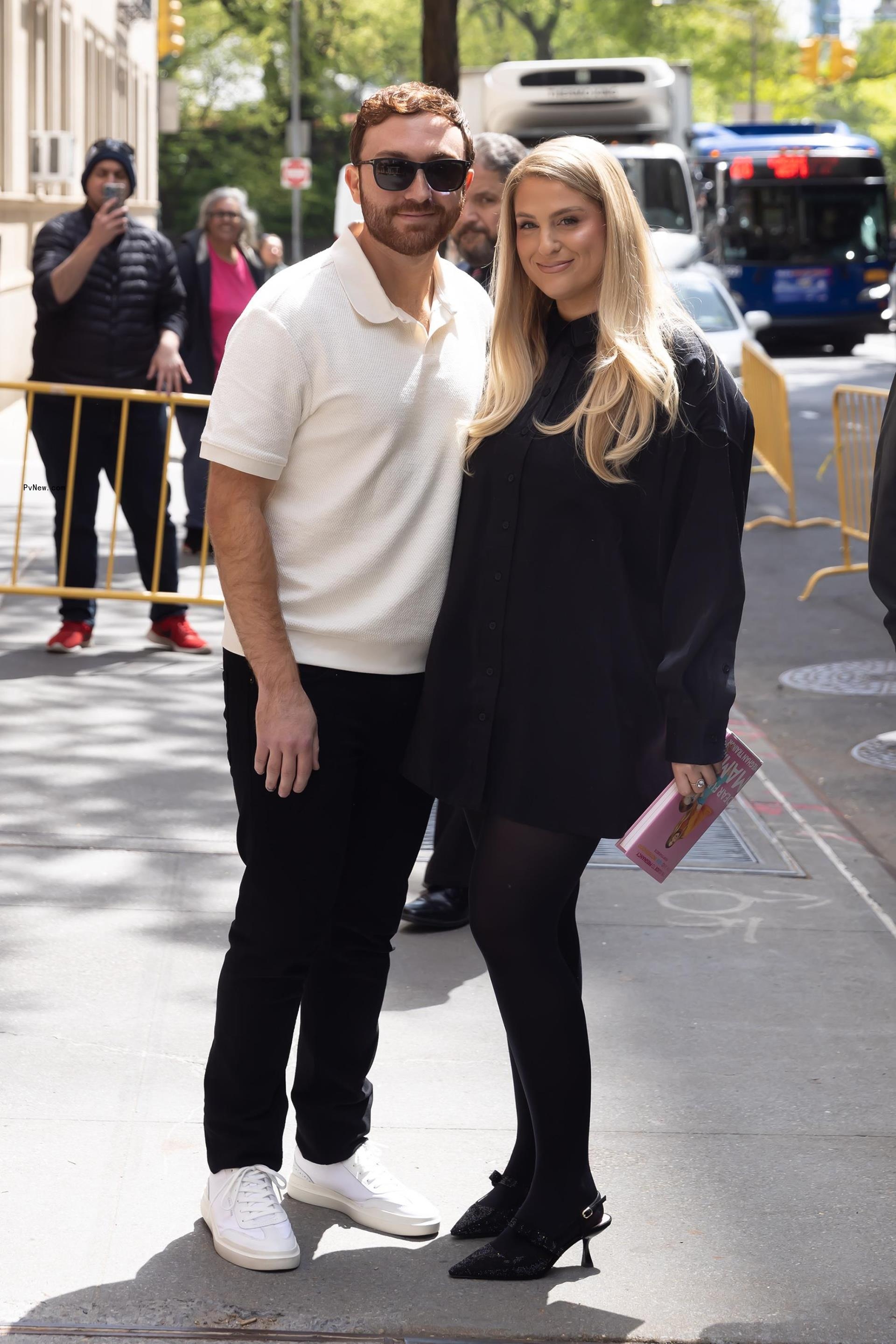 Meghan Trainor poses on street with Daryl Sabara