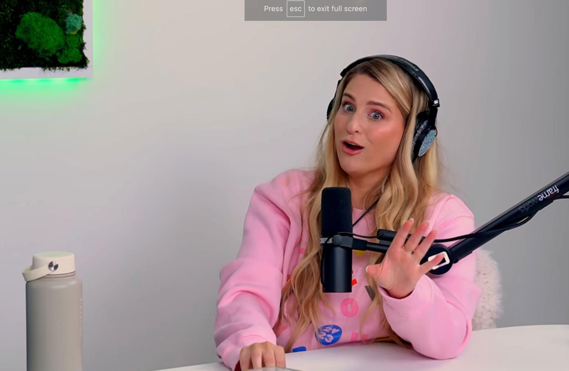 Meghan Trainor speaks into mic