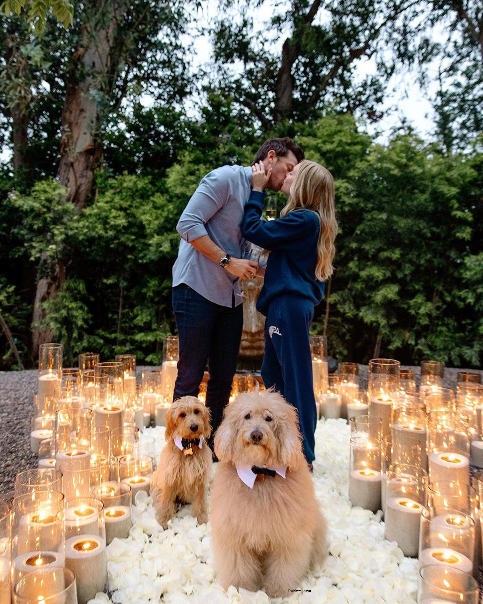 Matt Kaplan kissing Alex Cooper after proposing to her