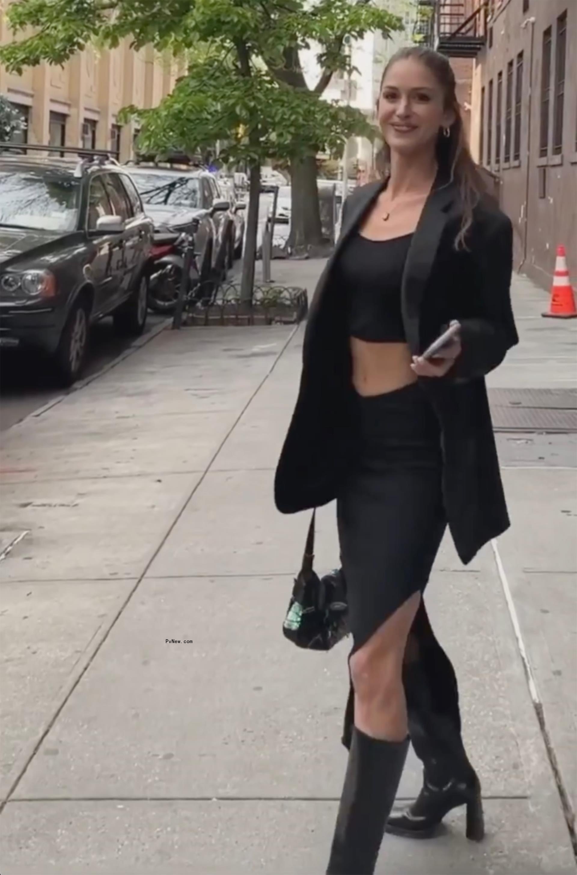 Gigi Paris posing outside.