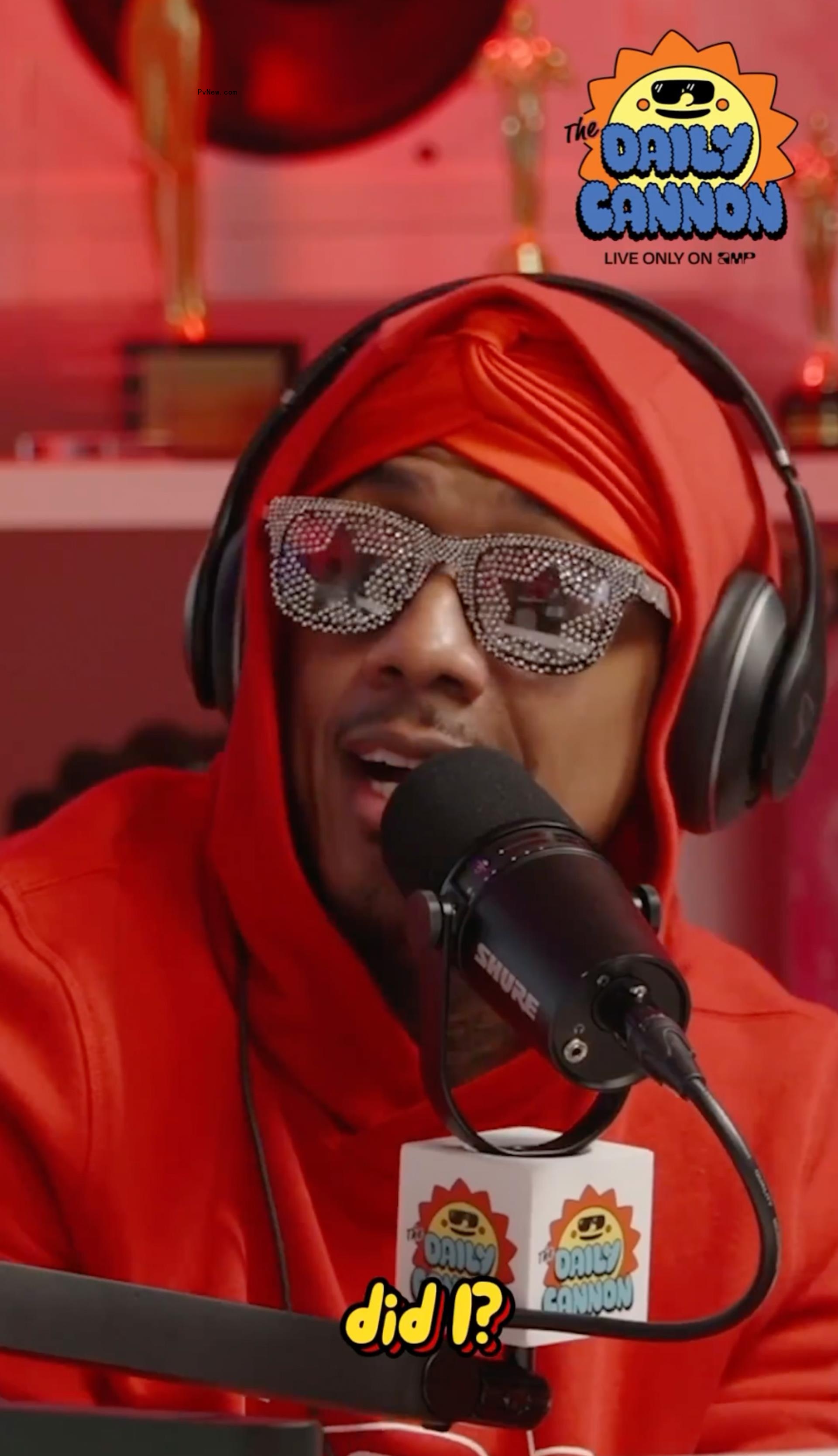 Nick Cannon speaks into mic